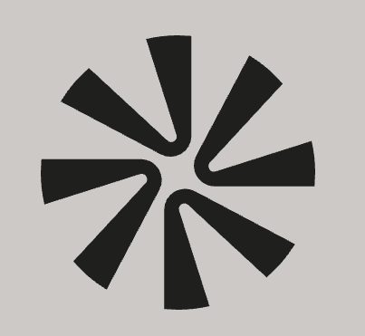 A bright orange circle adorned with six small dots positioned around its edge.