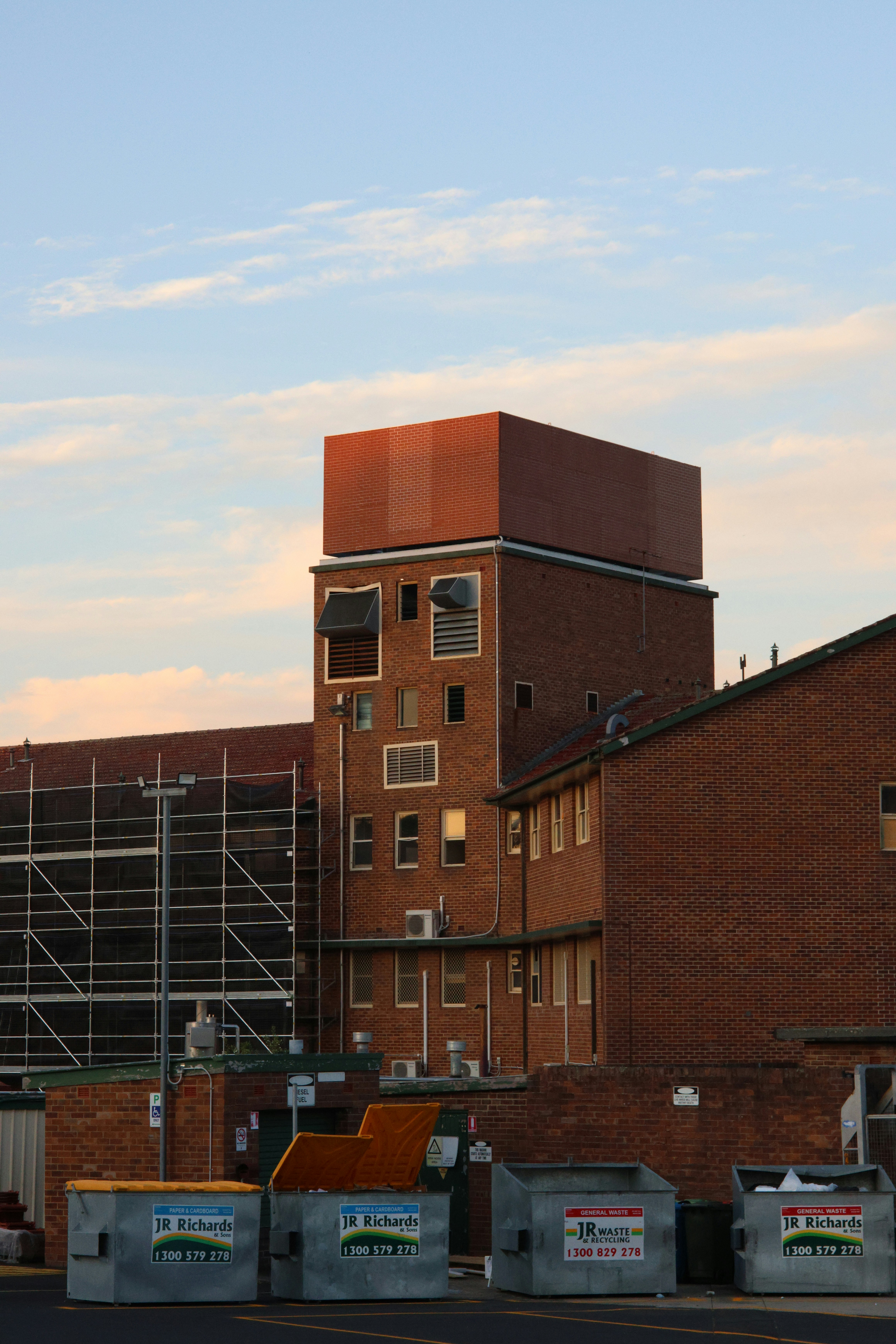 a tall brick building with scaffolding around it