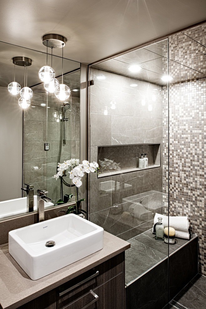 Image of Luxurious primary ensuite bathroom with modern design, spa-like shower and high-end interior design elements by KHD Homes.