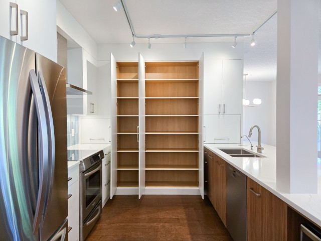 Image of Modern kitchen interior with layout design, furniture, and home renovations by KHD Homes featuring kitchen.