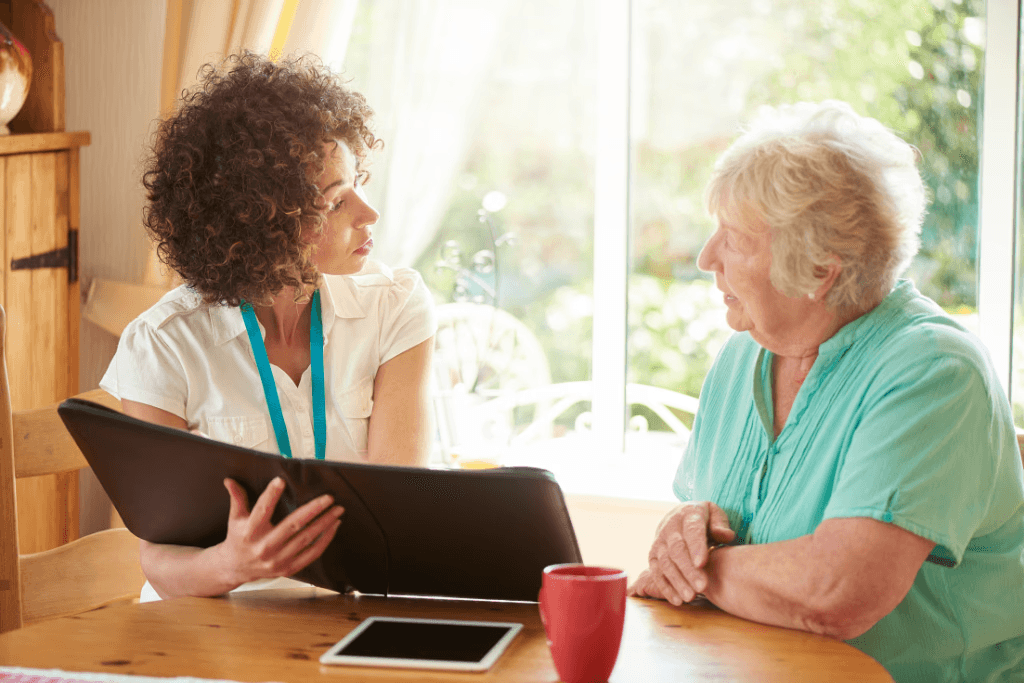 Elderly woman looking at a binder