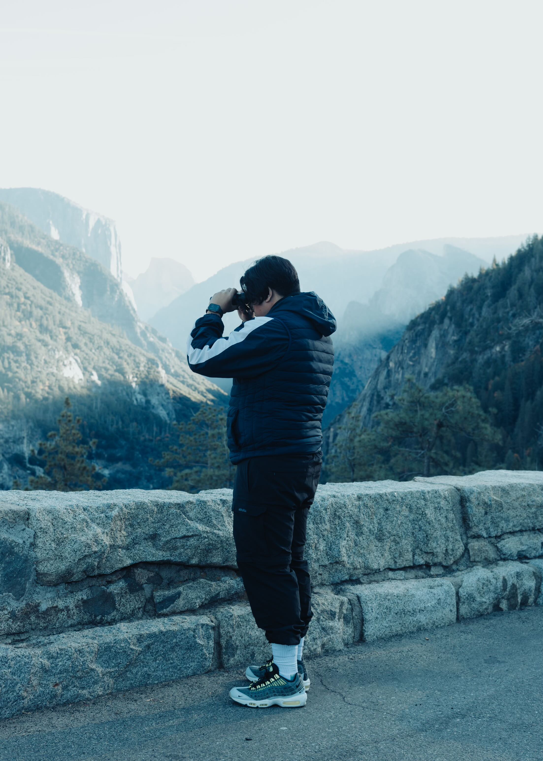 Photograhper taking a picture in the mounitans