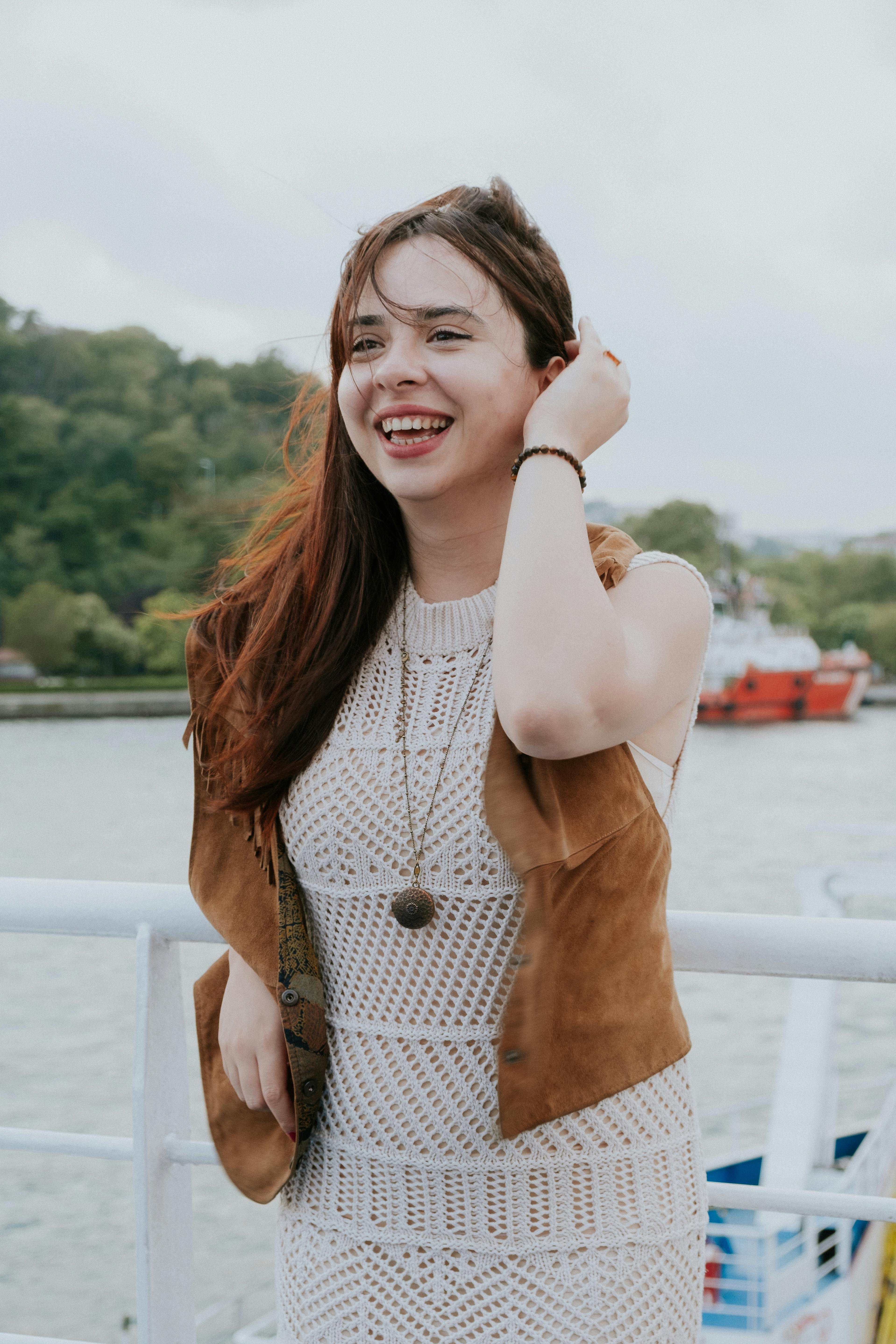 A person in a white shirt black coat with the fair skin looking infront