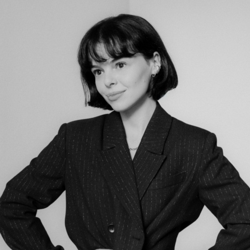 Sara is a client smiling to the camera happily