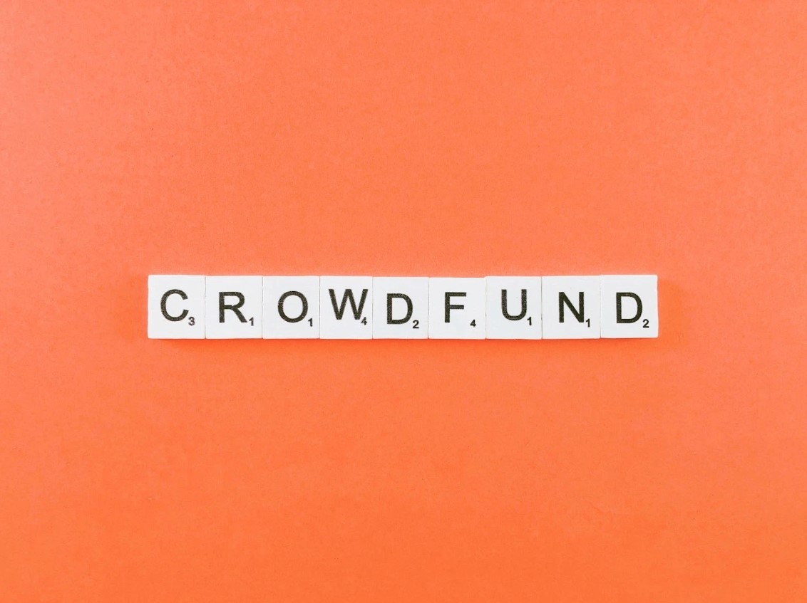 Word "crowdfund" on word tiles. 