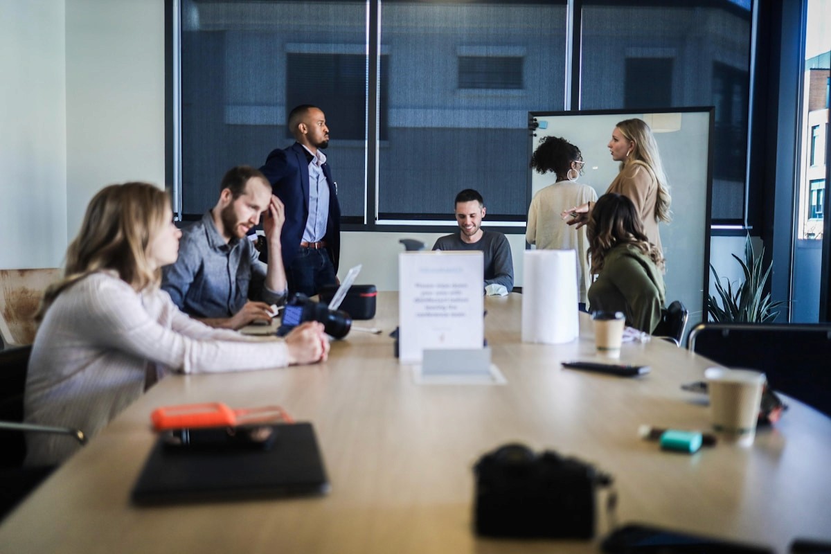 Team laughing together in a meeting room