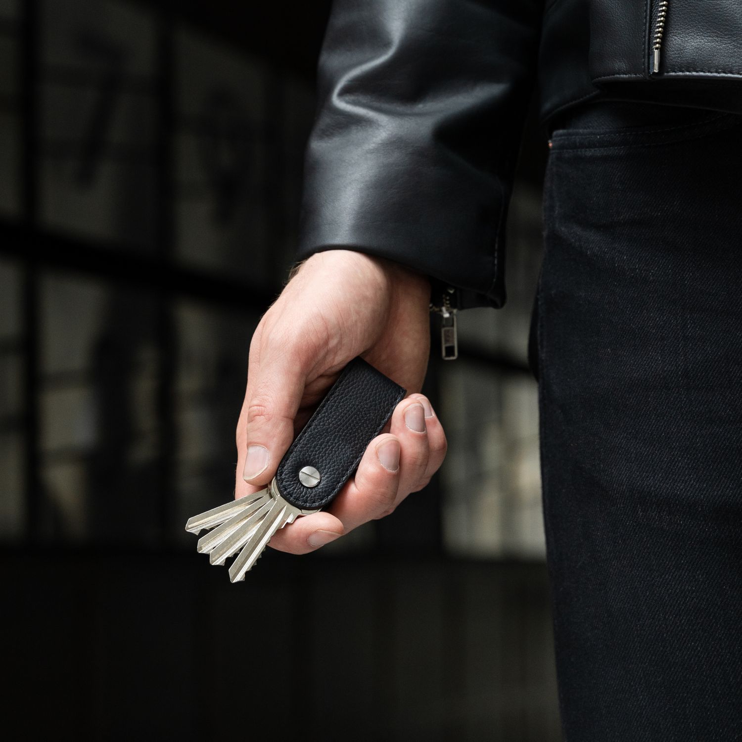 Key organizer accessory in male hands