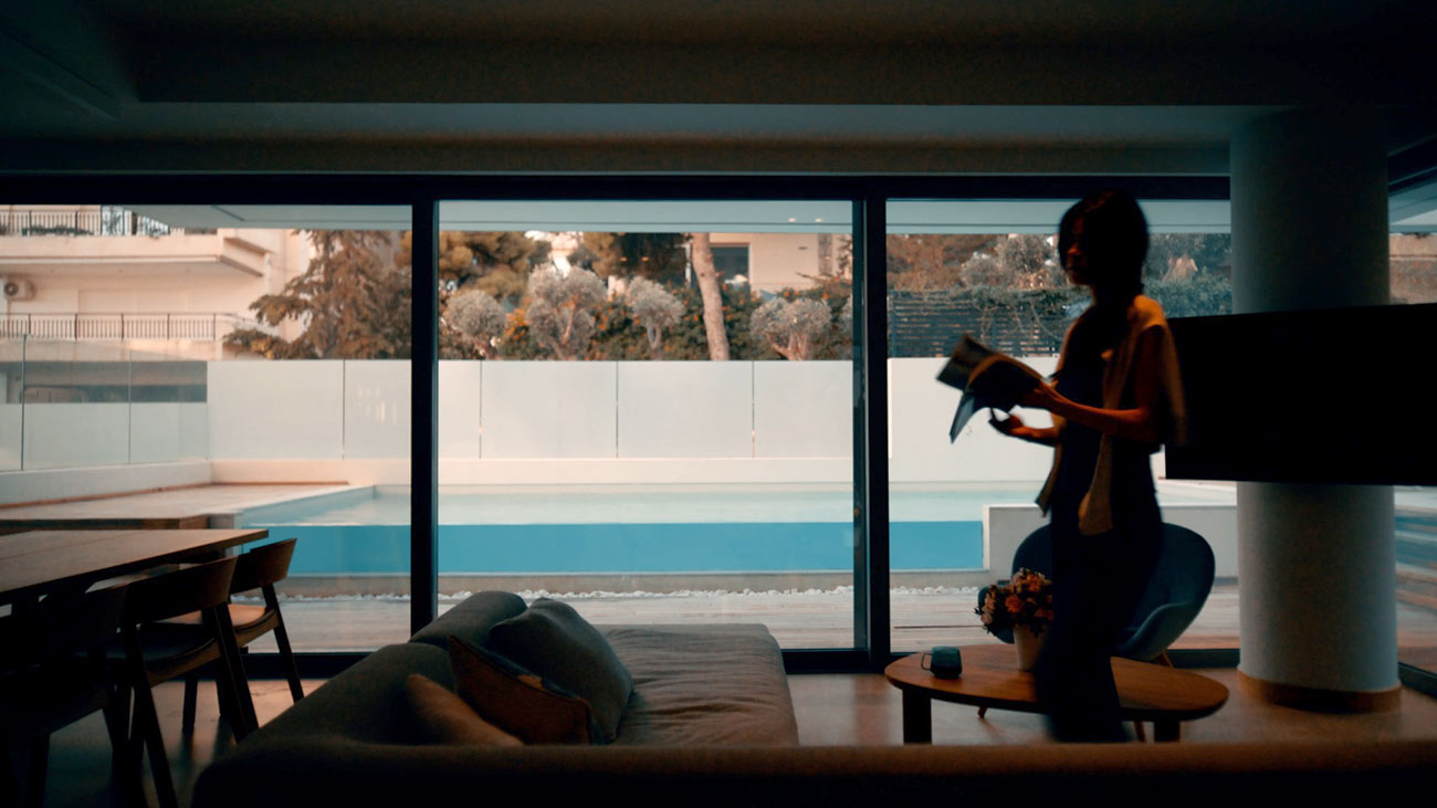 Lifestyle scene in a MIA Developments residence with a pool view, photographed by TERAMOK