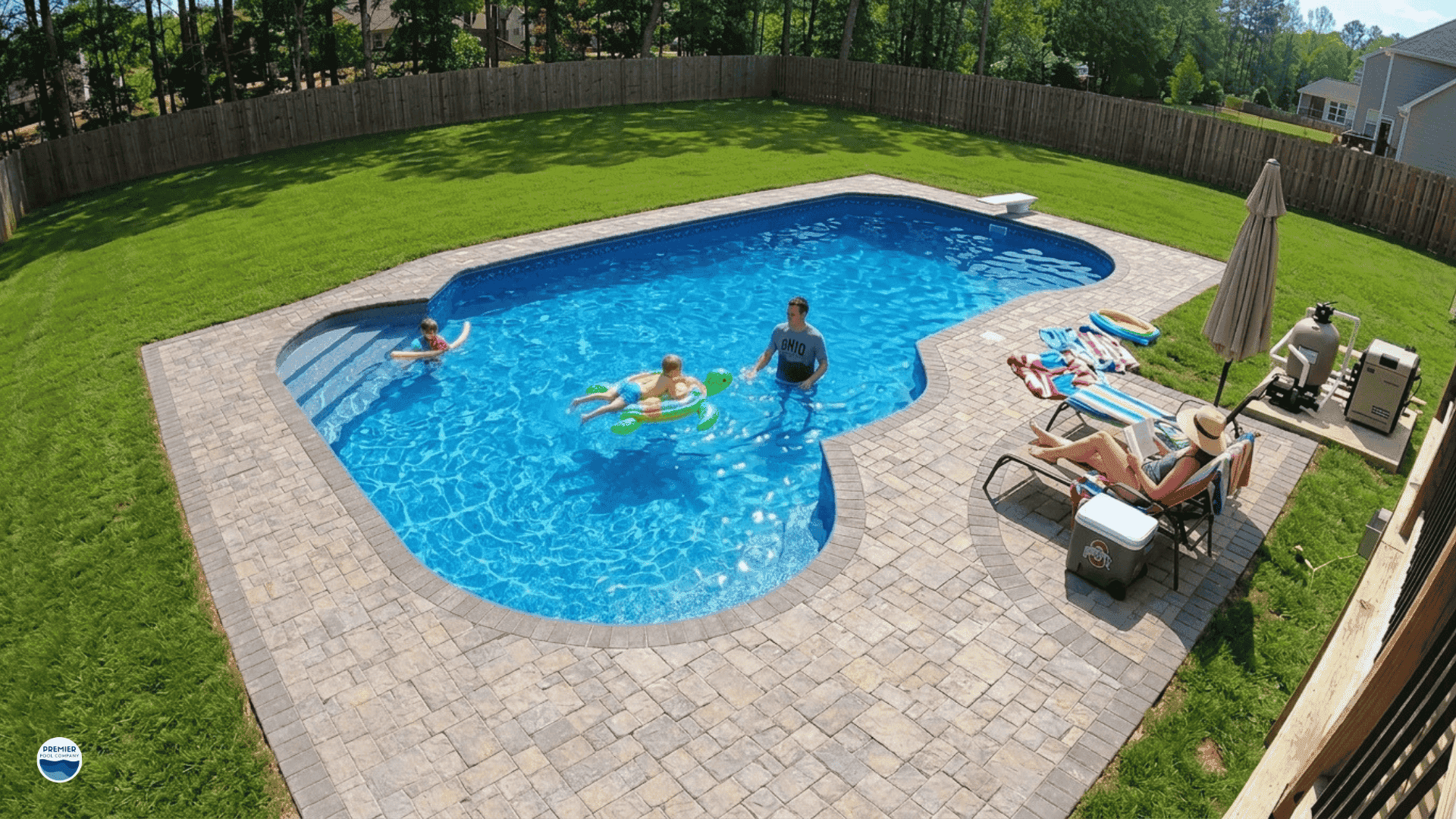 Family enjoying vinyl liner pool in backyard during summer in Ohio