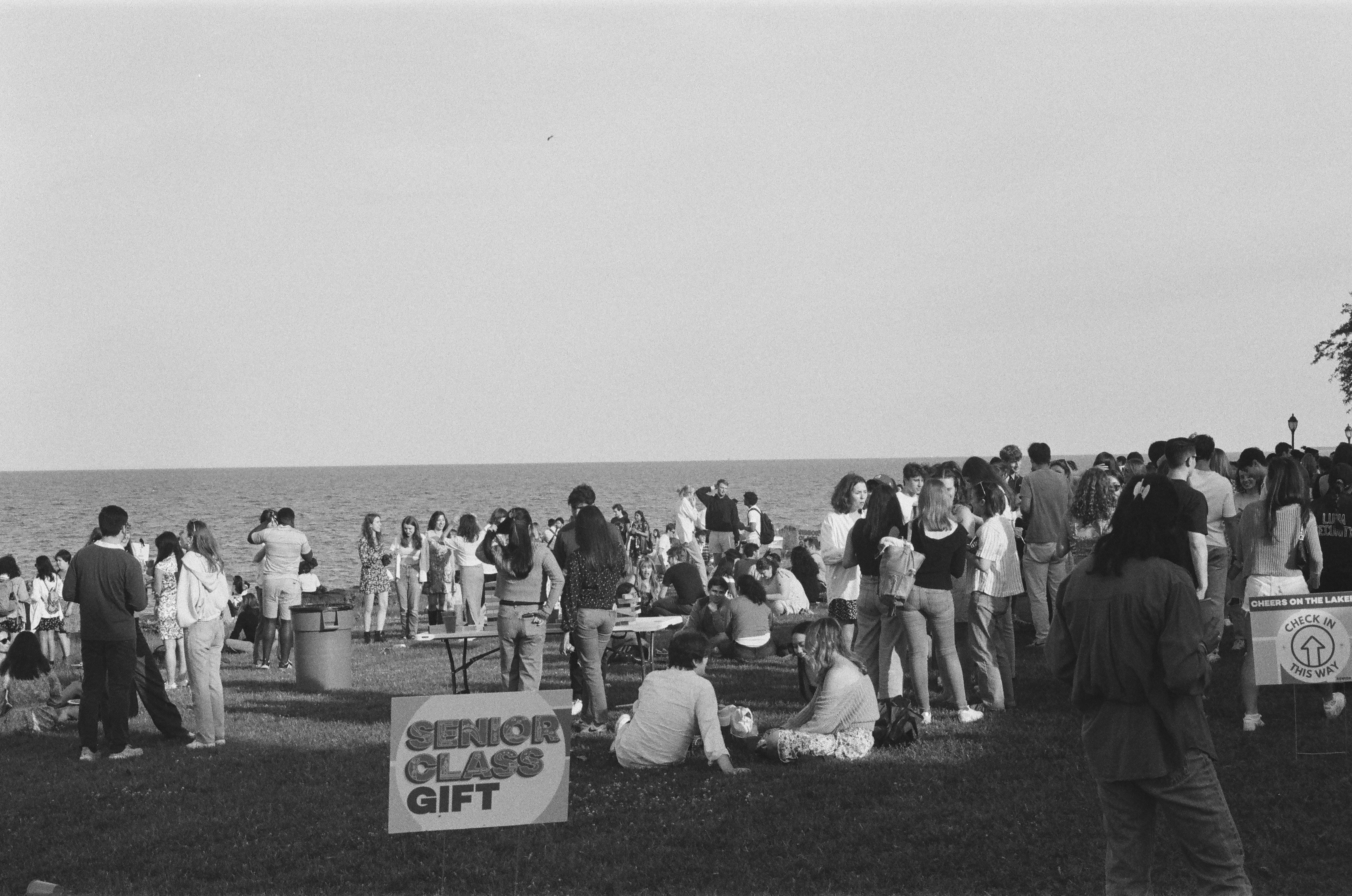 Group sitting by lake