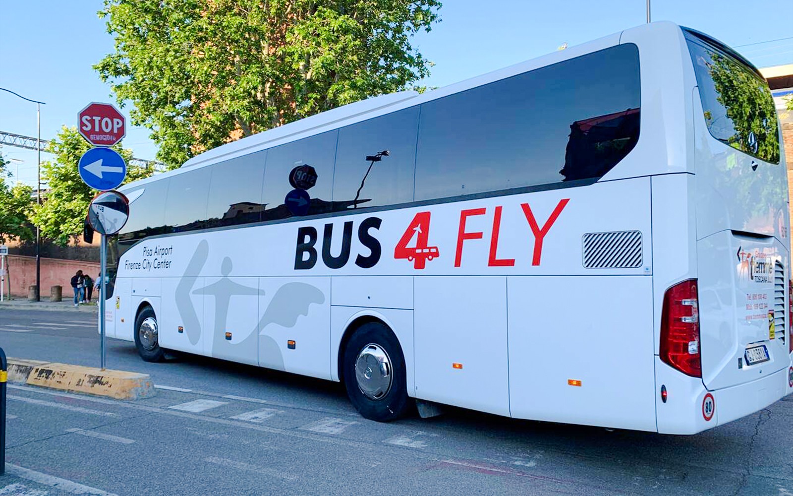 Direct transfer bus labeled "Bus4Fly" at Pisa Airport.