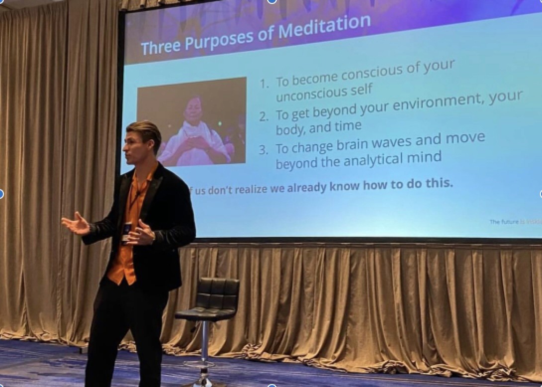 Confident two female professional using a laptop at a bright workspace with a coffee cup