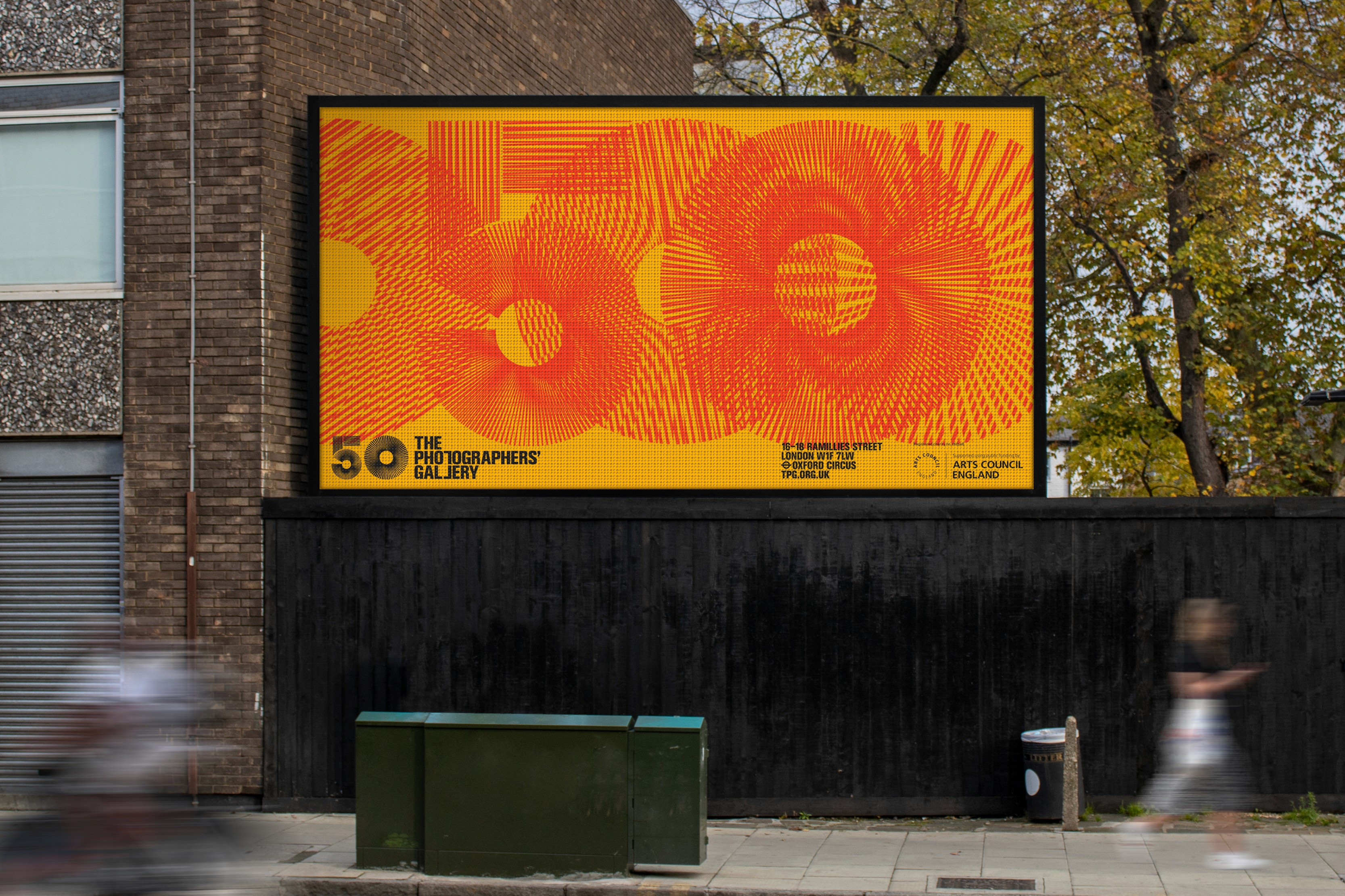 A large billboard displaying the number "50" in bold orange against a bright yellow background.