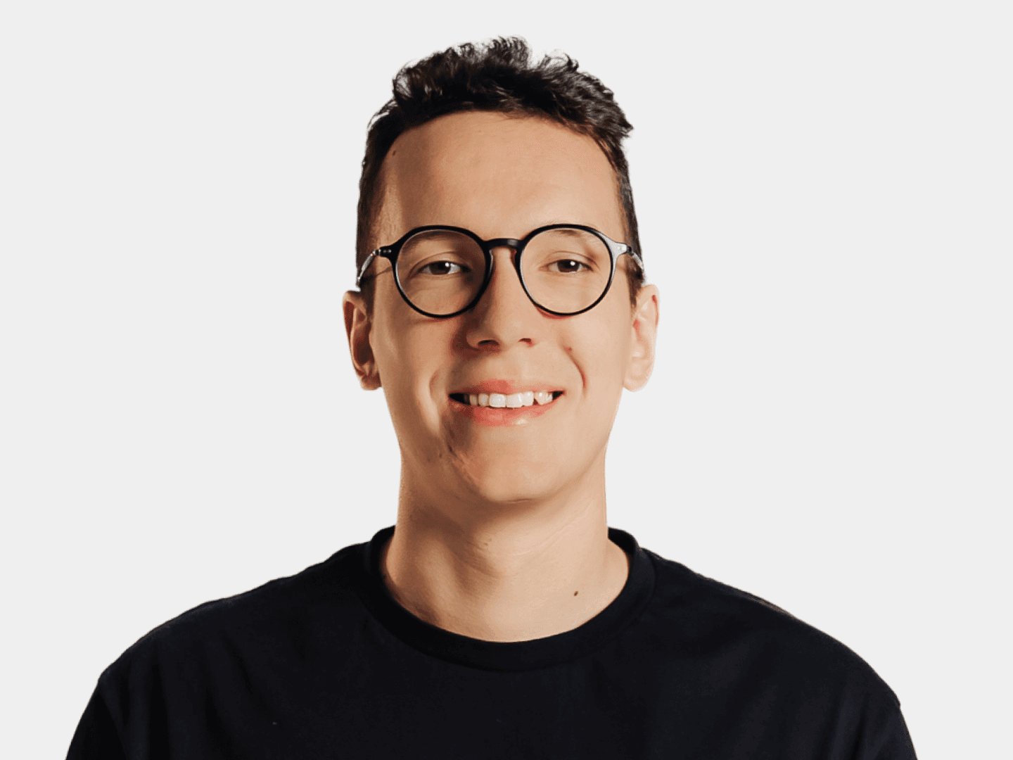 Artistic portrait of a man wearing glasses, illuminated by a diagonal streak of light against a gray background.