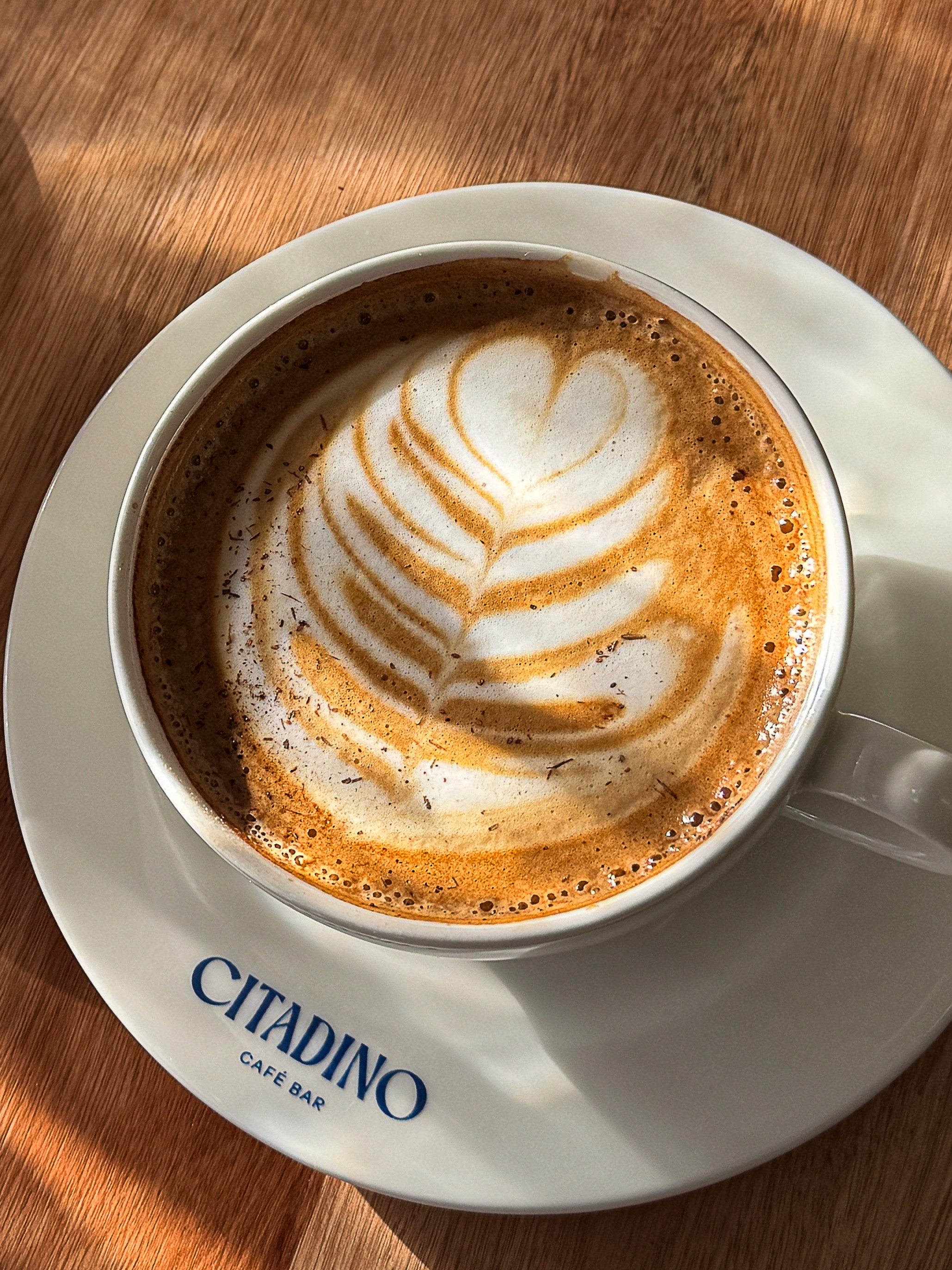 focus photography of coffee artwork