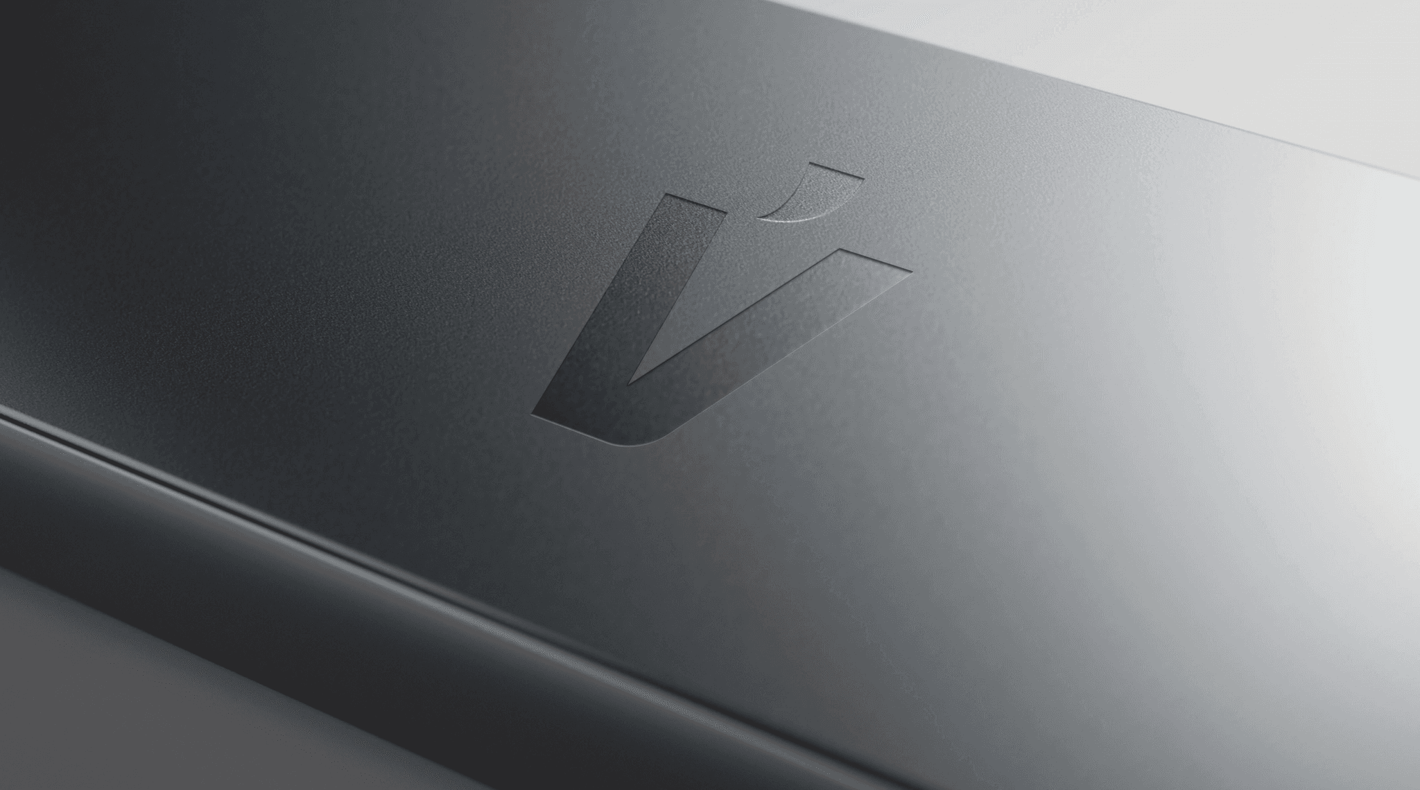 A shiny silver trophy on a black base, symbolizing achievement and victory.