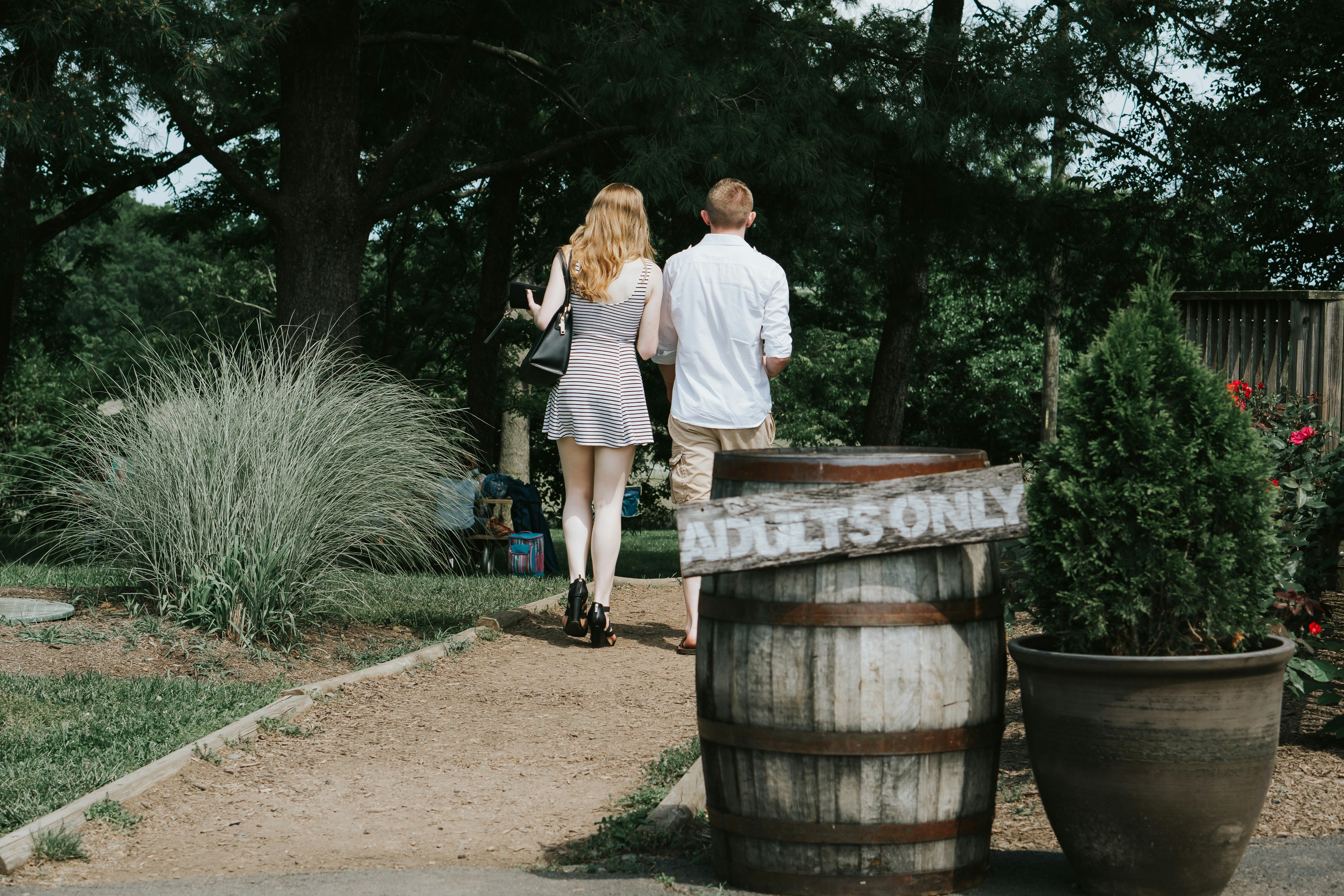 A Couple Walking Through a Garden