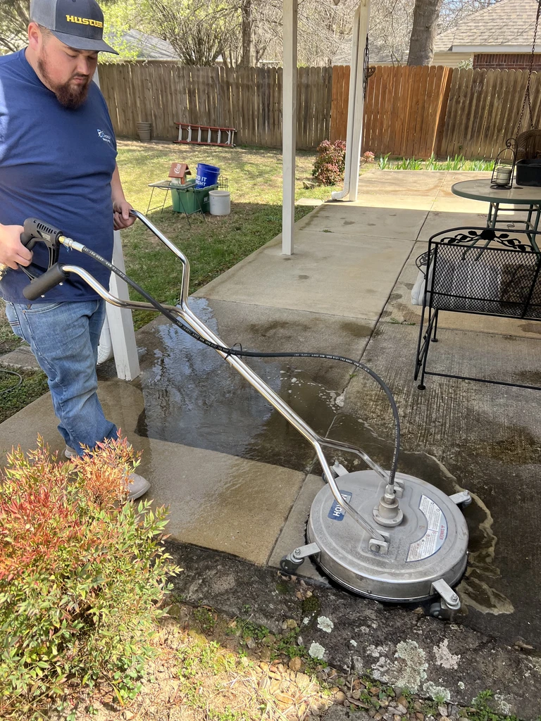 Power washing algae off backyard patio