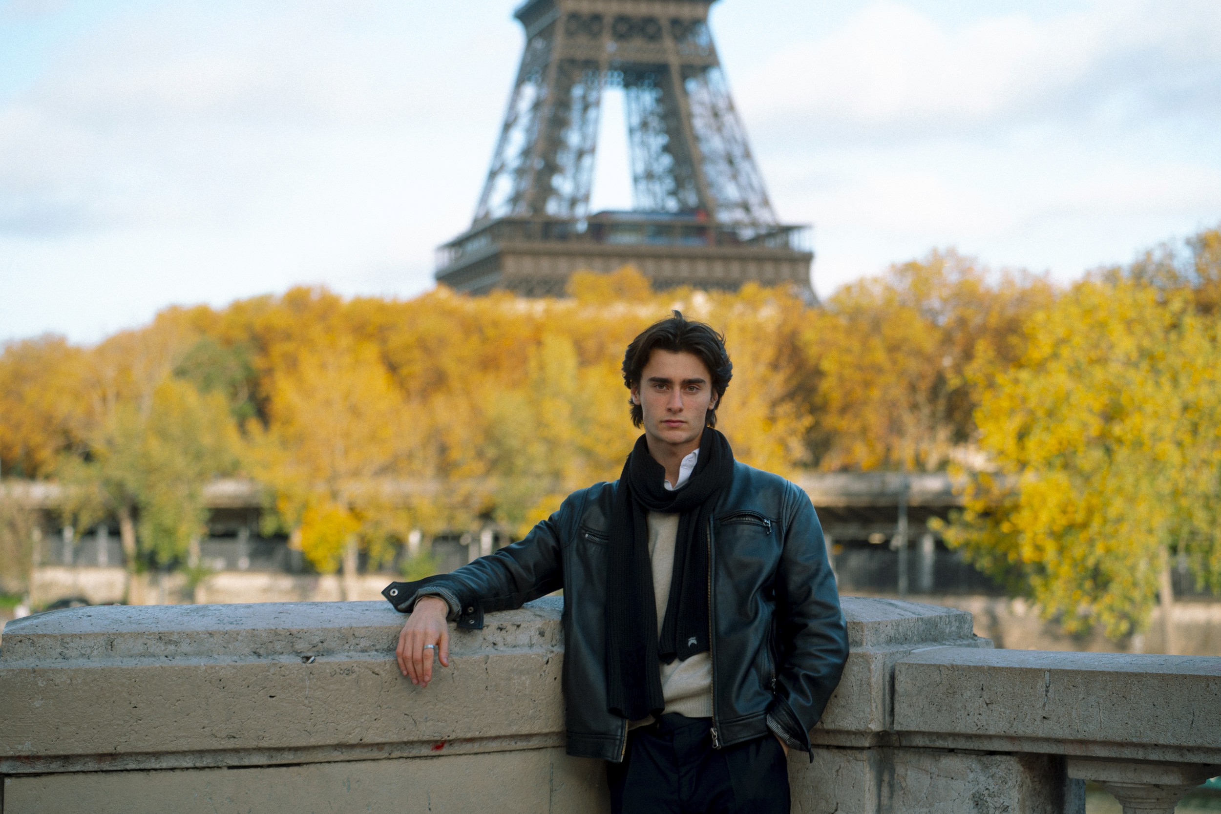 A person stands in a sandstone cave.