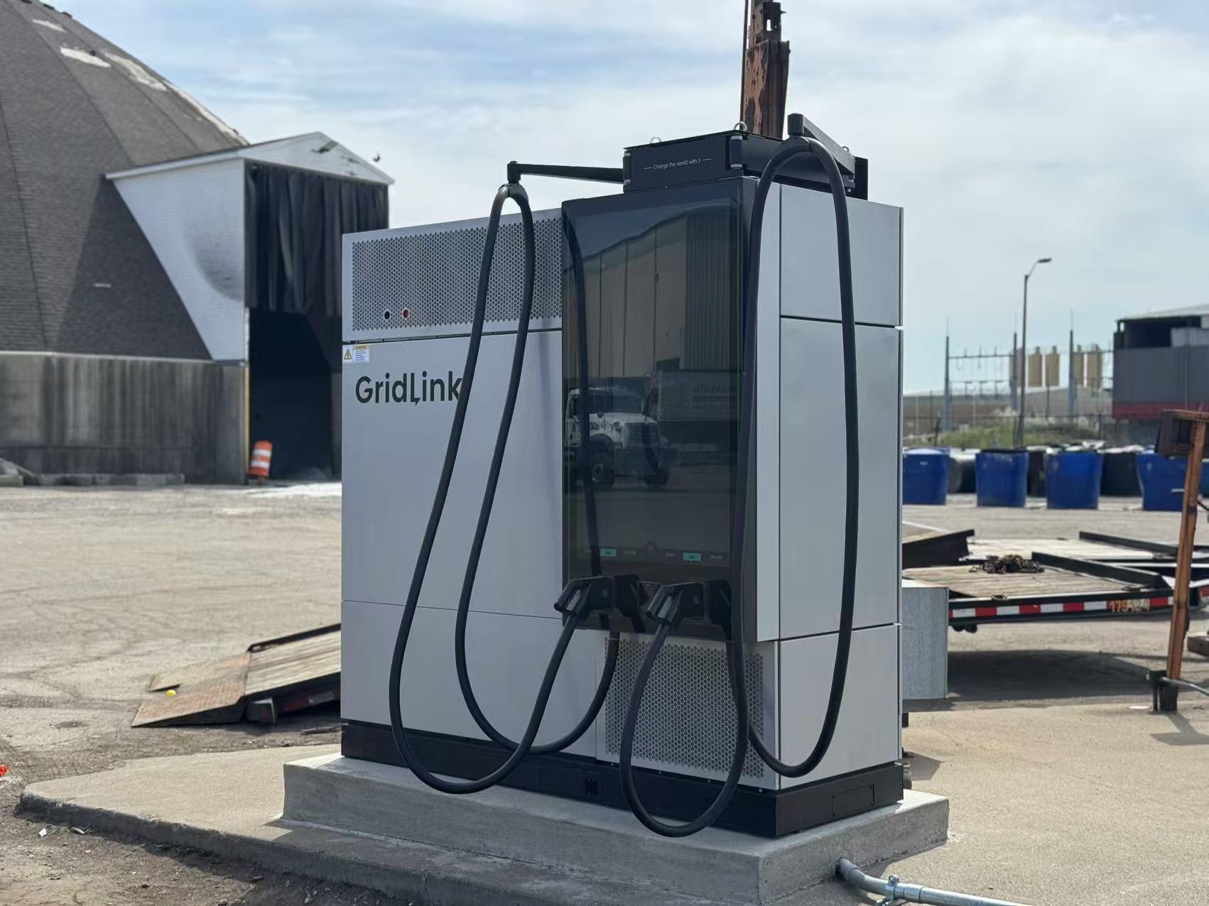 C6AM Charger in front of a pink hotel building