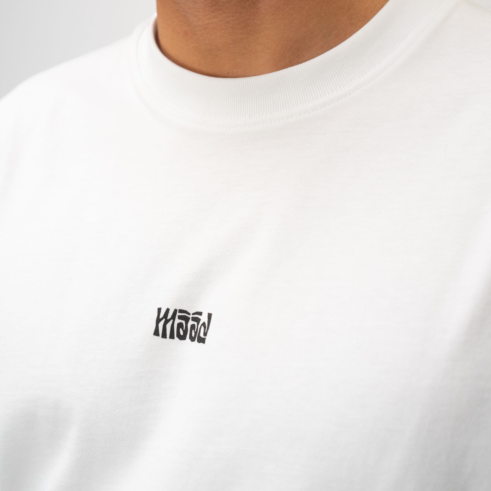 White t-shirt with a black logo on a plain background