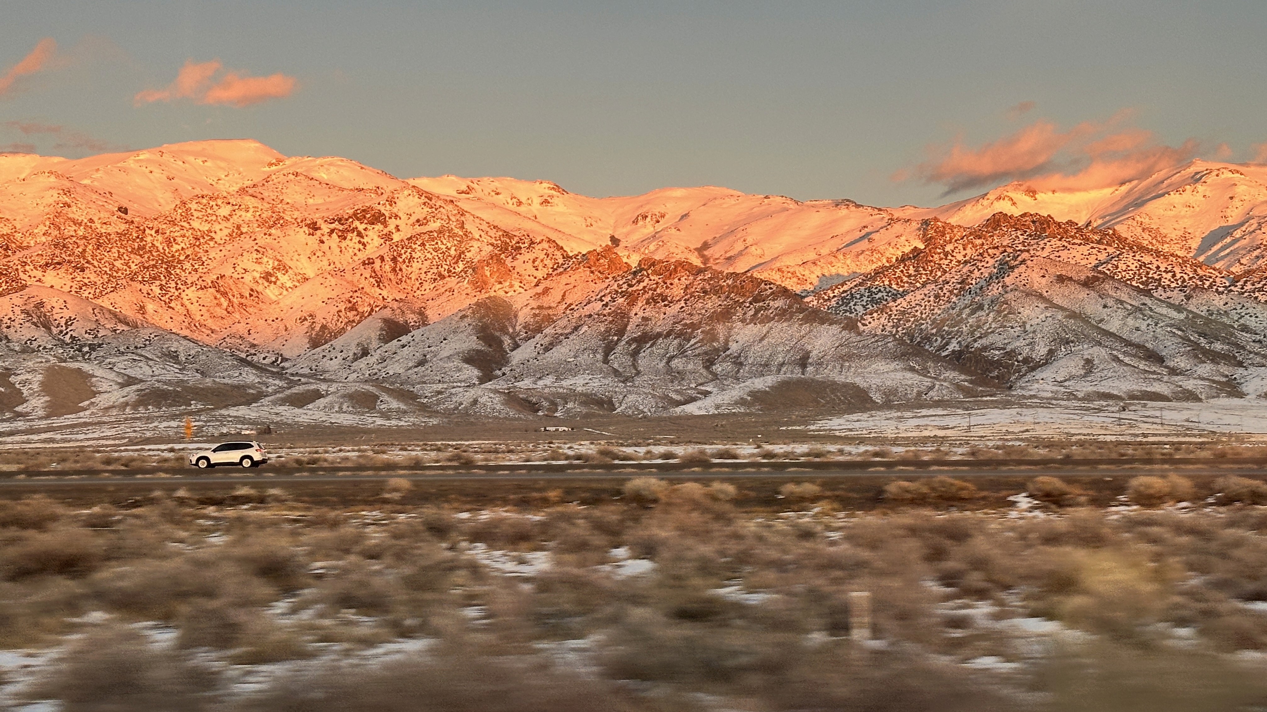 a group of people walking on a sidewalk