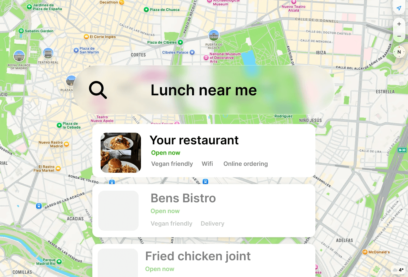 man standing beside table while holding food