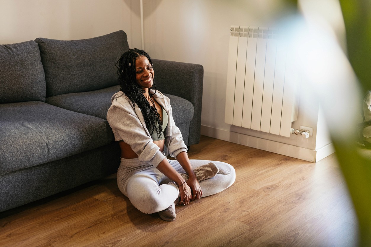 Homeowner relaxing comfortably indoors after fast emergency AC repair in Toronto