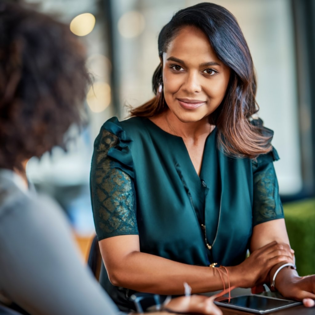 Professional Immigration Consultant discussing immigration options with a client.