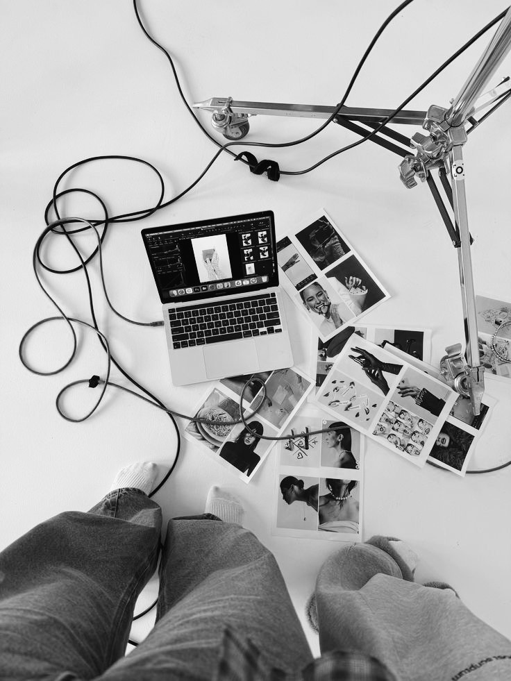 Portrait of a person in dark clothing speaking on a phone