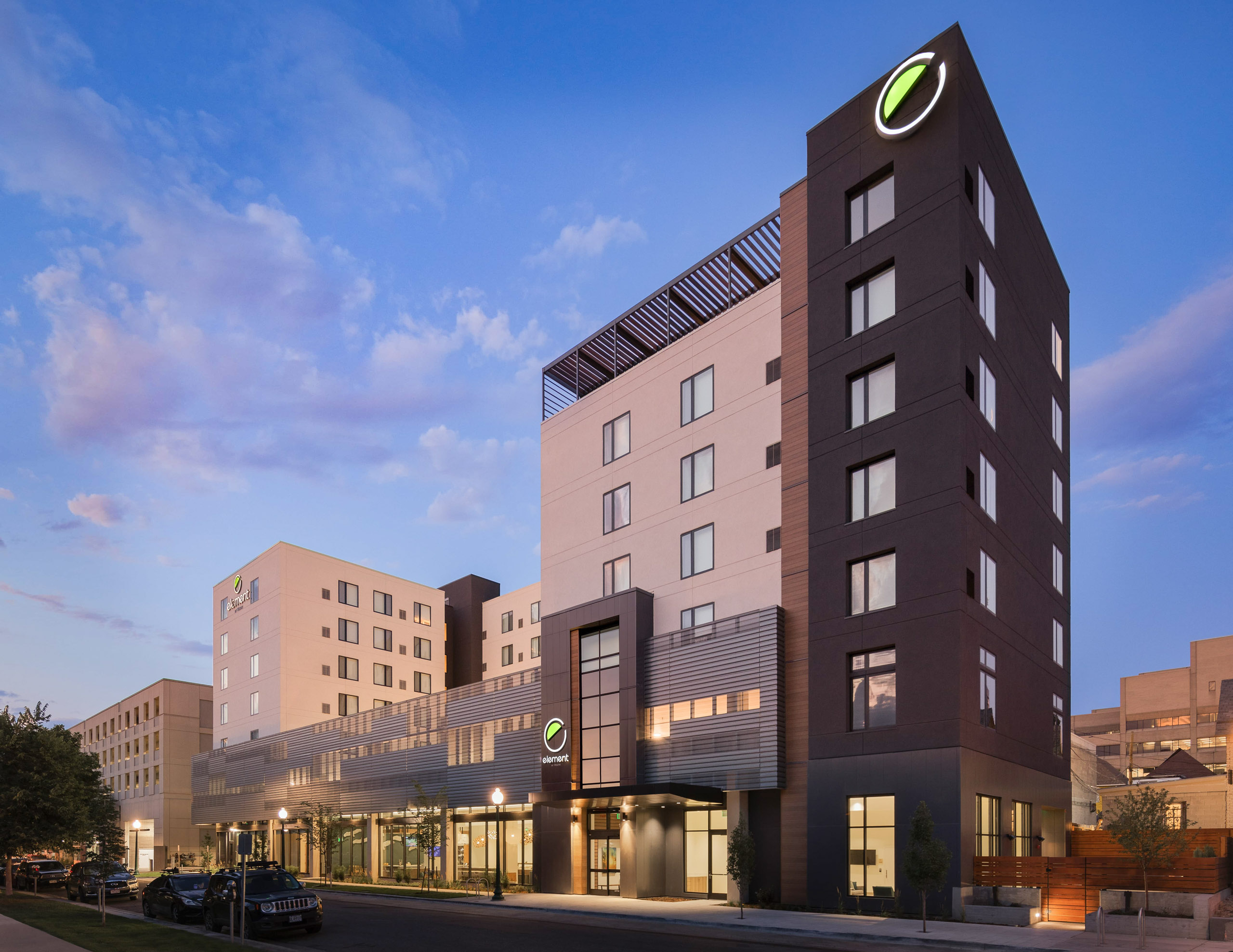 Element Hotel building with logo at dusk.