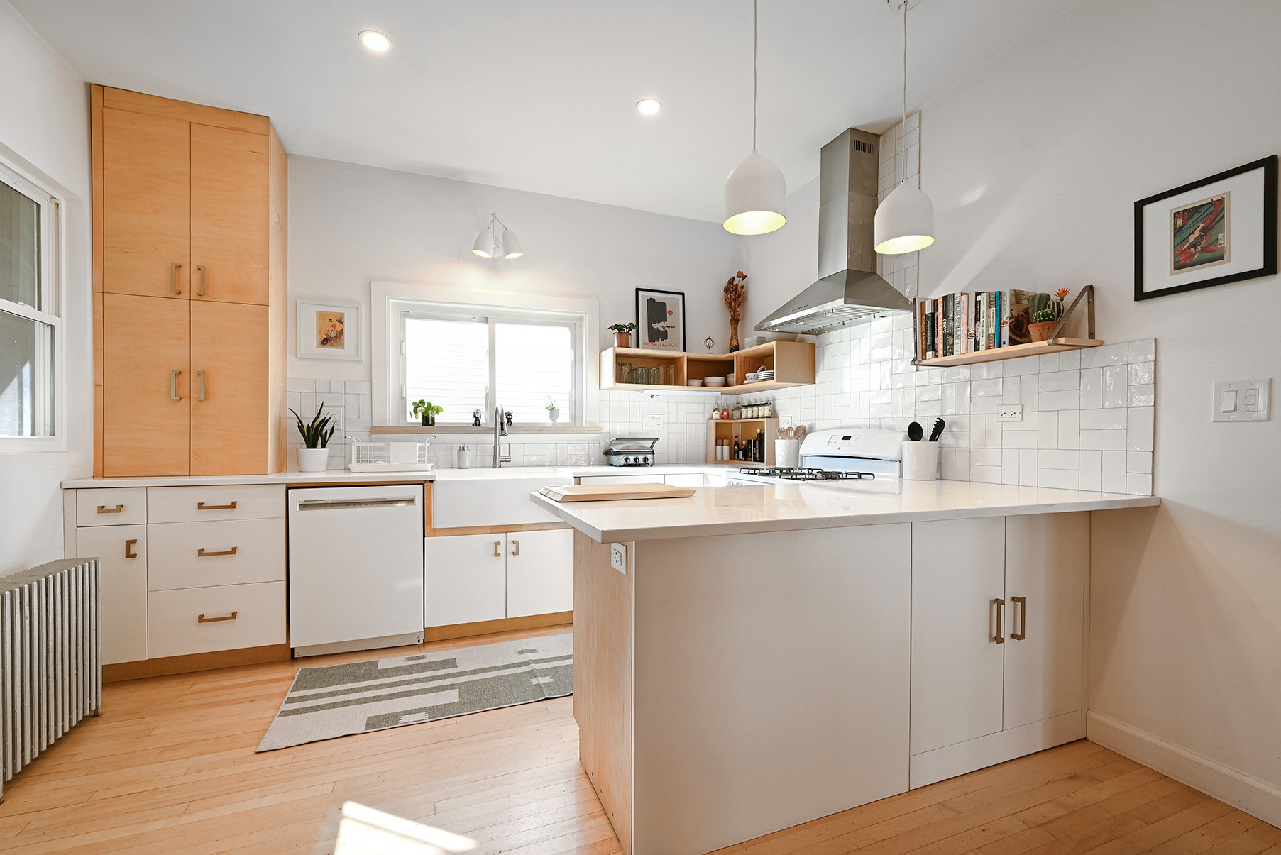 Modern kitchen design with white and natural wood cabinets
