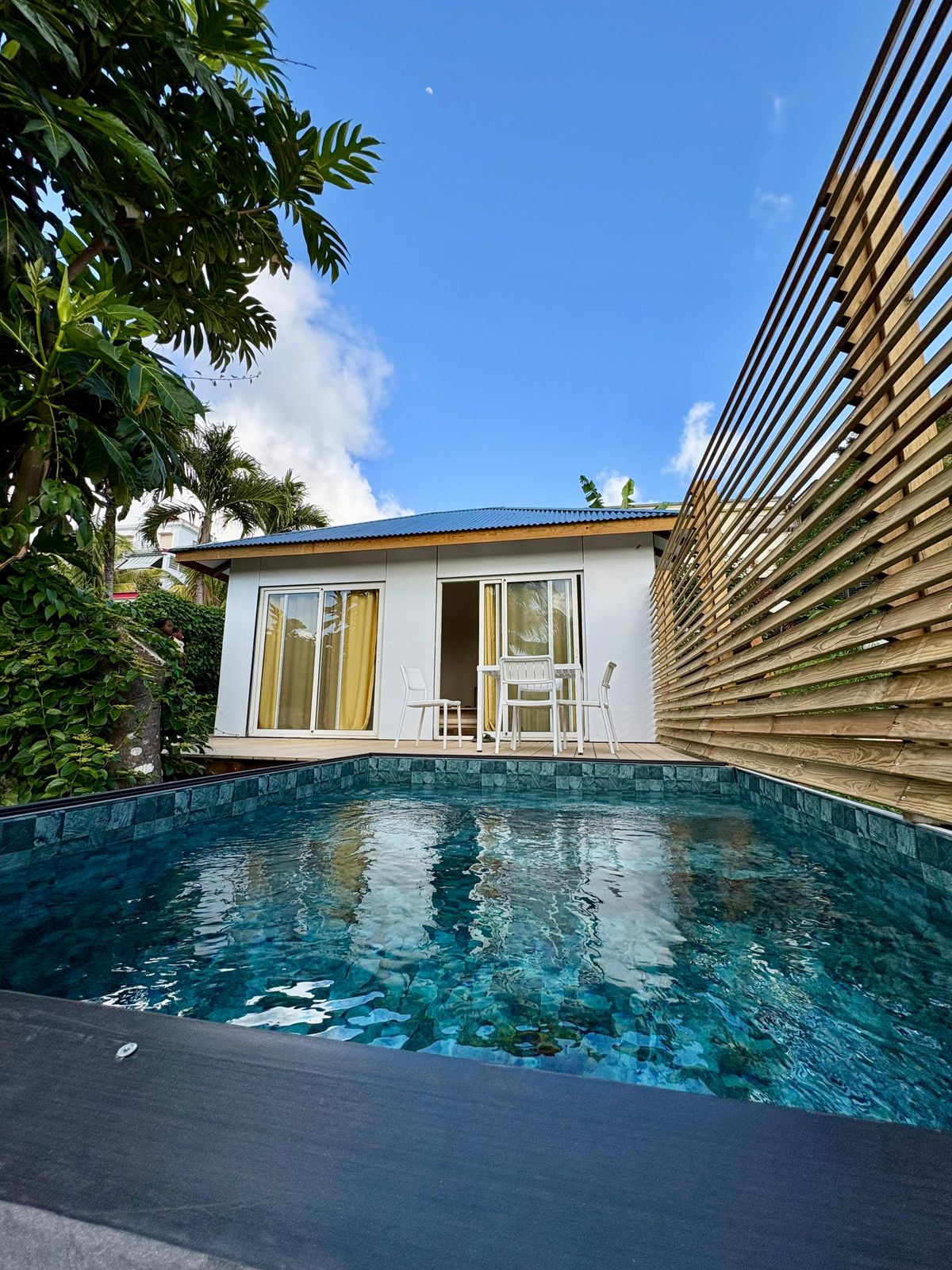 a house with a white fence in front of it
