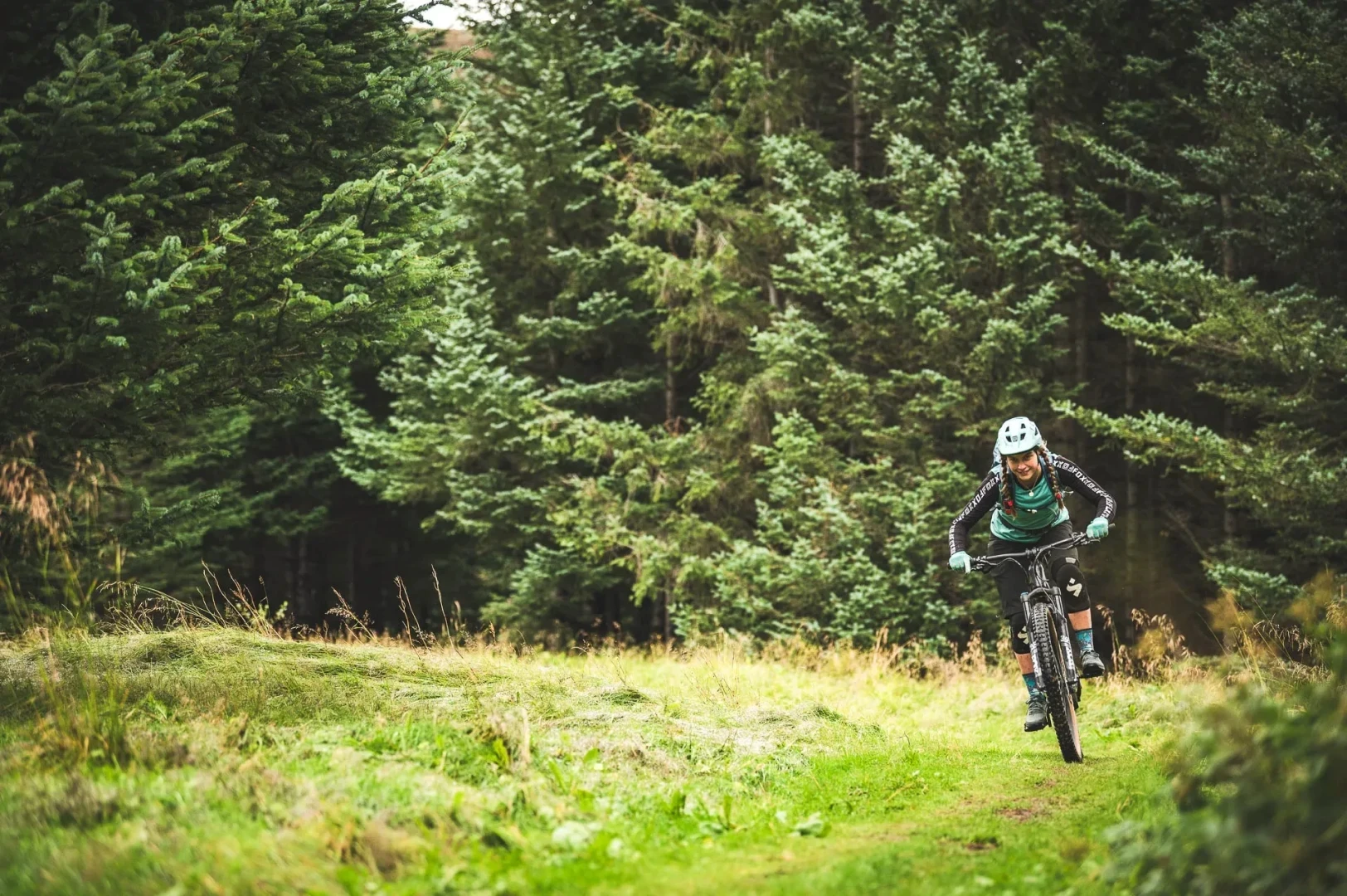 Woman rides towards camera