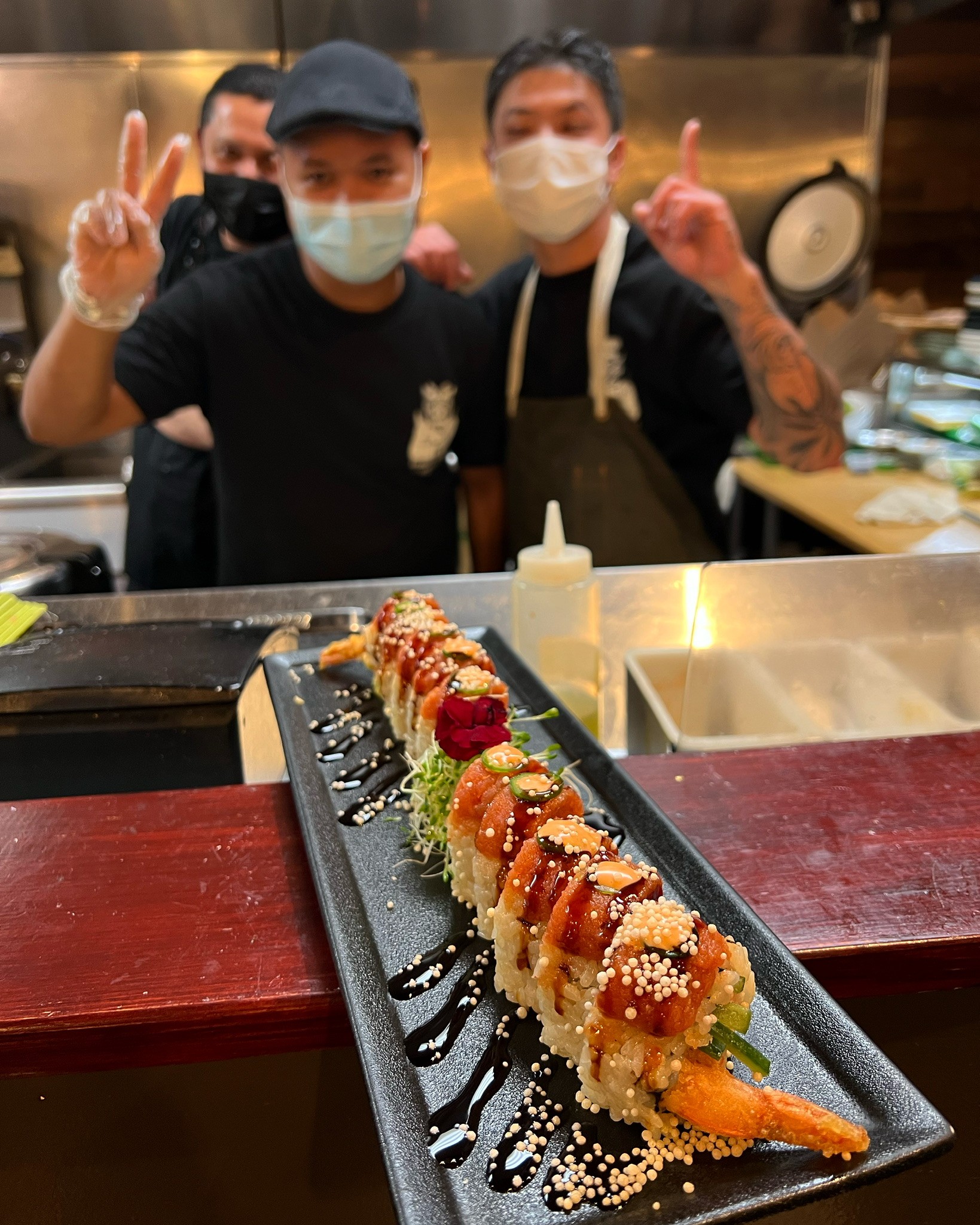 A chic table setting at Izakaya Tora, featuring artisanal plates and chopsticks, ready for an authentic Japanese fusion meal in West Hollywood.