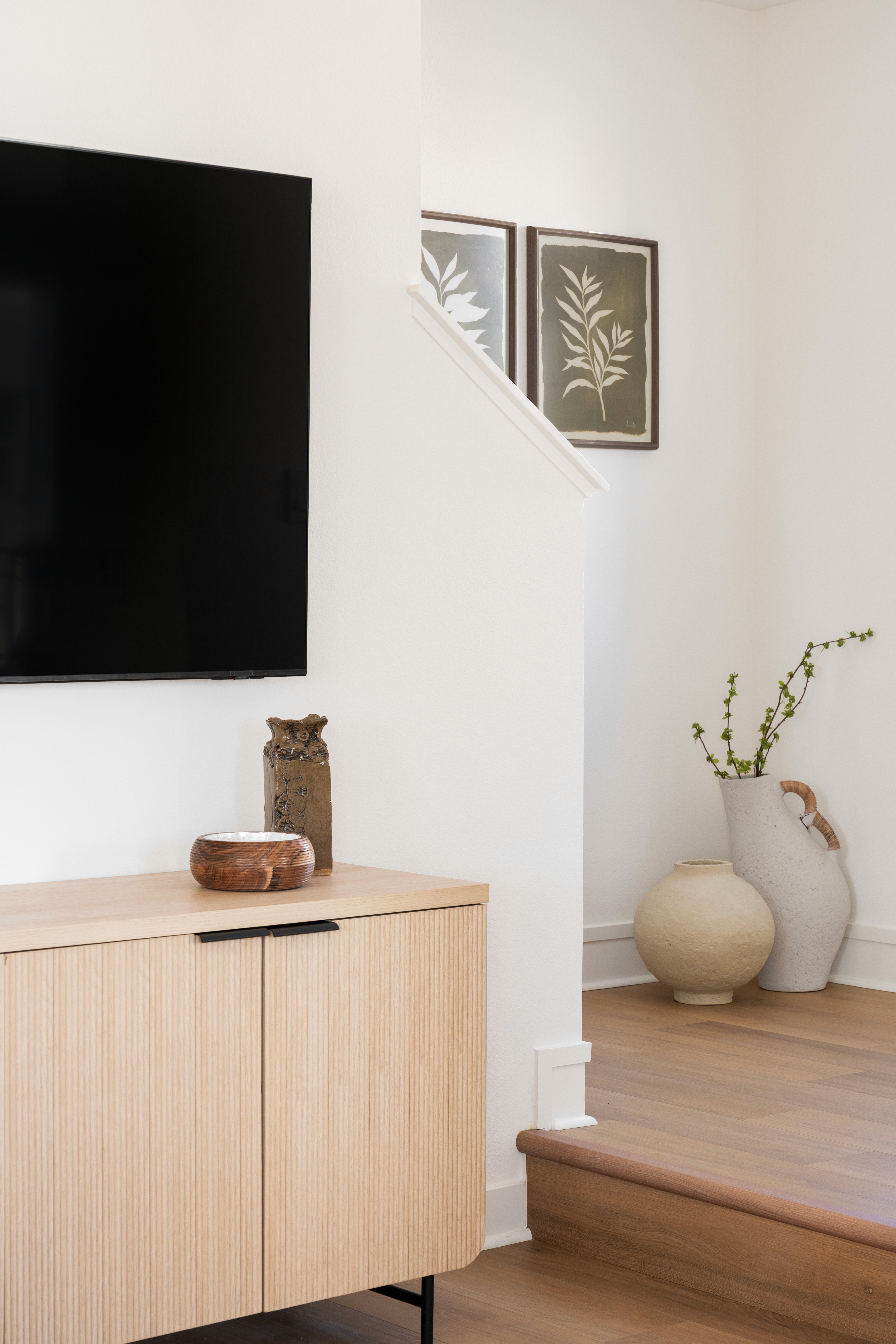 Entertainment area with view of stairs leading upstairs