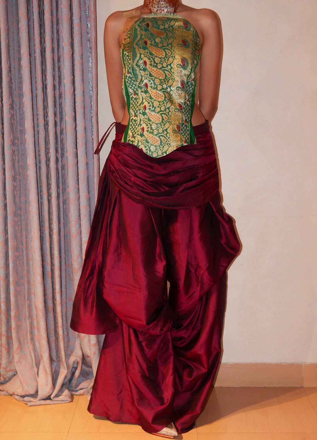 Apsara is our high-neck, backless top crafted from a vintage silk saree, inhouse by skilled artisans.