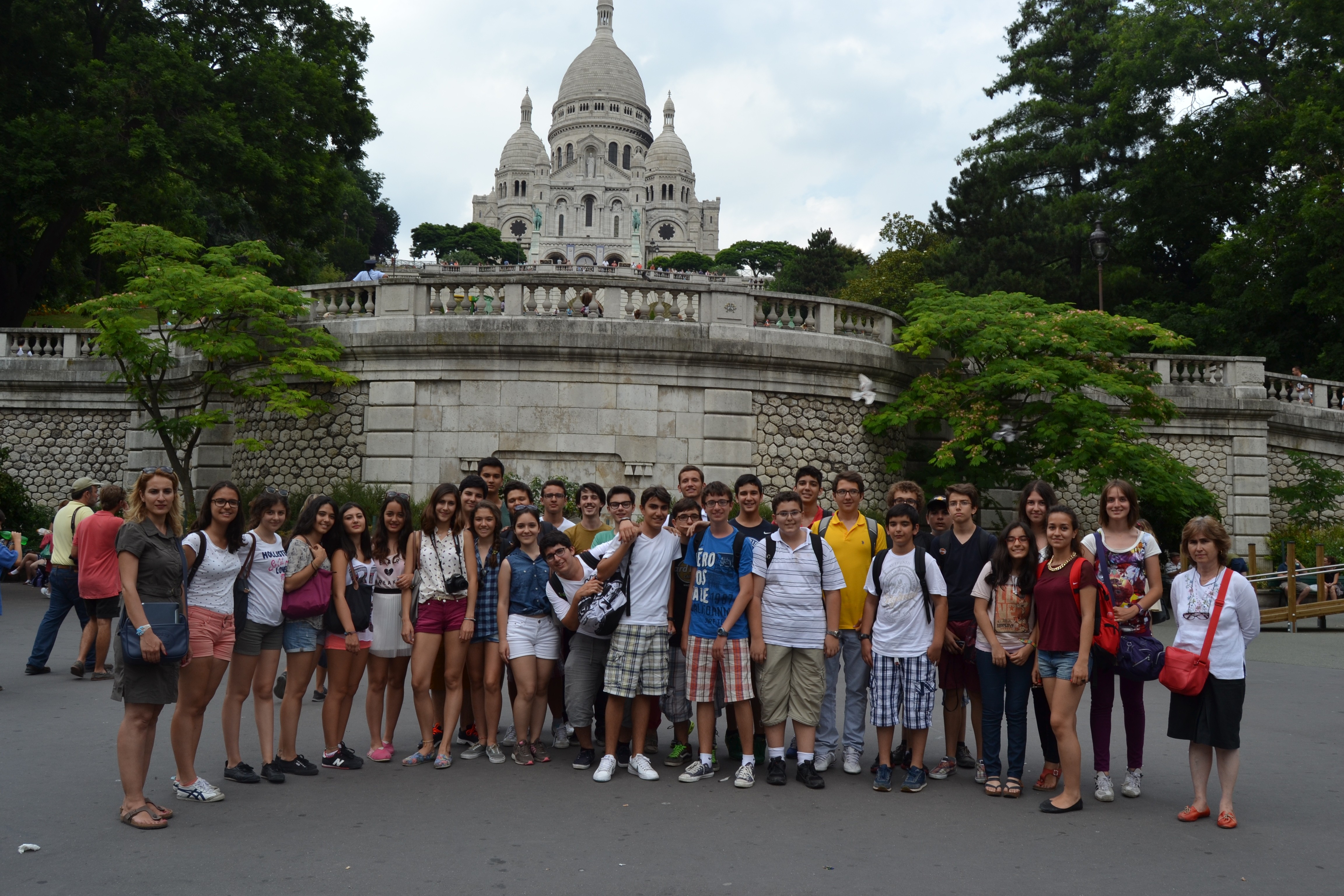 woman in green shirt sitting on books