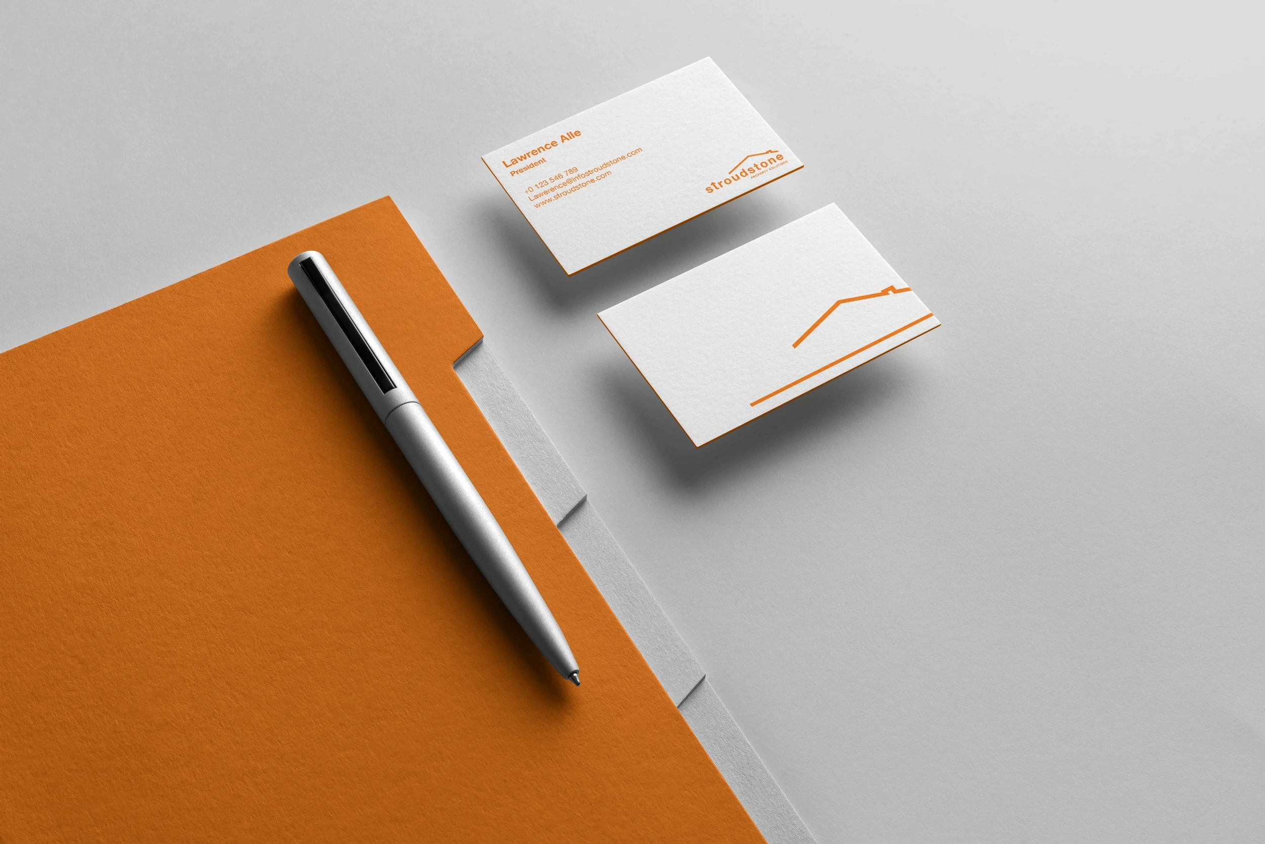 Brand identity design for Stroudstone including corporate folder, business cards and minimalist stationery with orange visual identity.