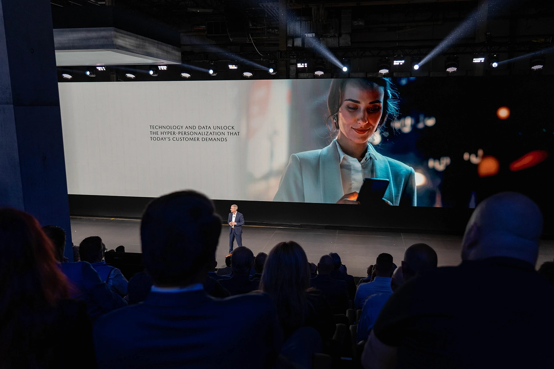 Mazda National Dealer Meeting executive on stage with audience in foreground