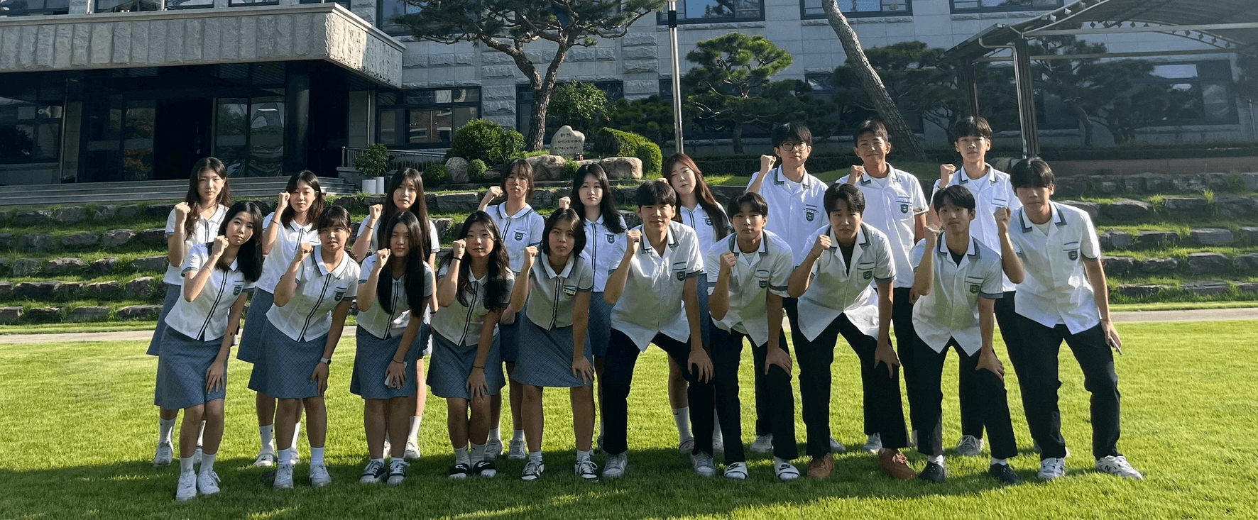 a group of young men standing next to each other on a basketball court