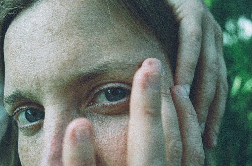grayscale photo of woman wearing necklace and top