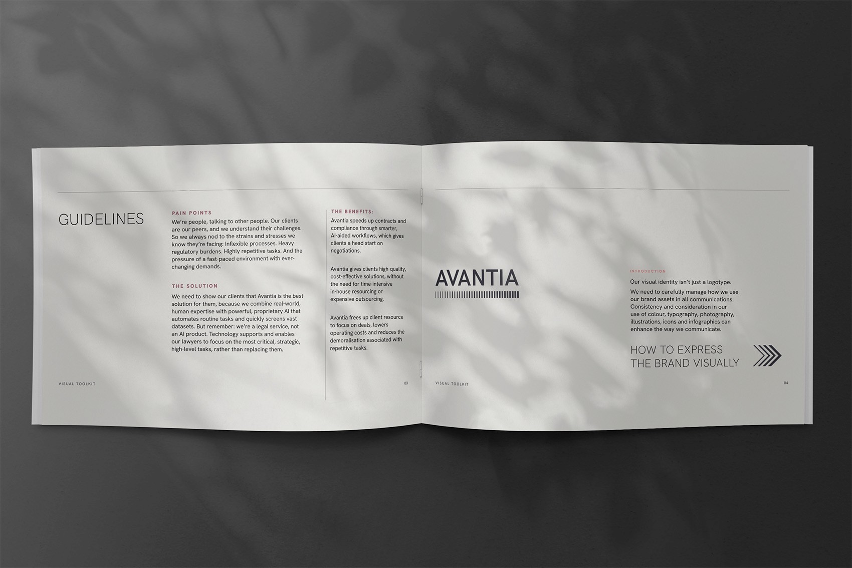 Open brand guideline booklet with the heading ‘GUIDELINES’ on the left page and ‘AVANTIA’ logo on the right. Sections outline pain points, solutions, and benefits of Avantia’s legal services. The spread features clean typography, soft shadows from foliage, and a minimal layout.