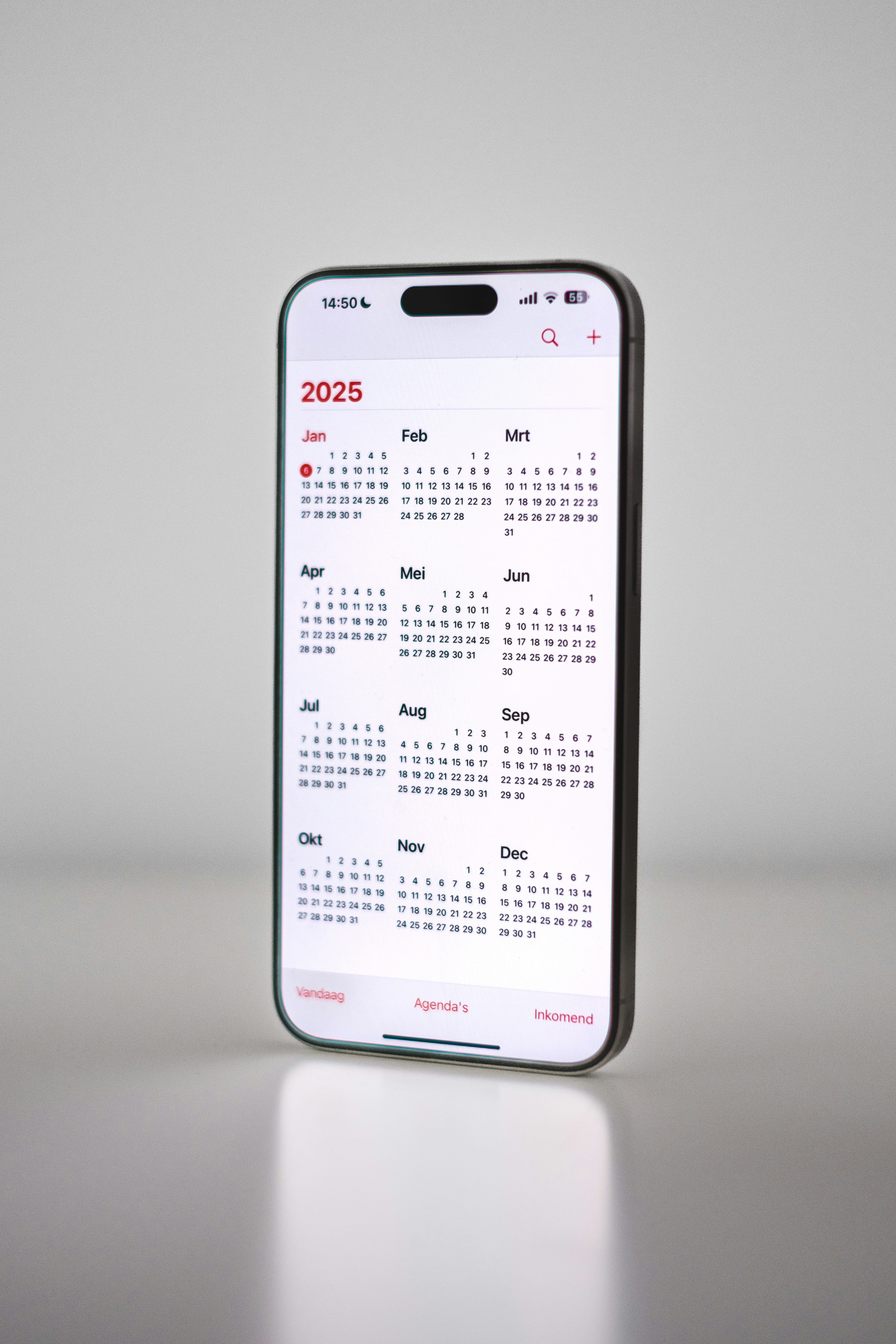 A phone with a calendar on the back of it