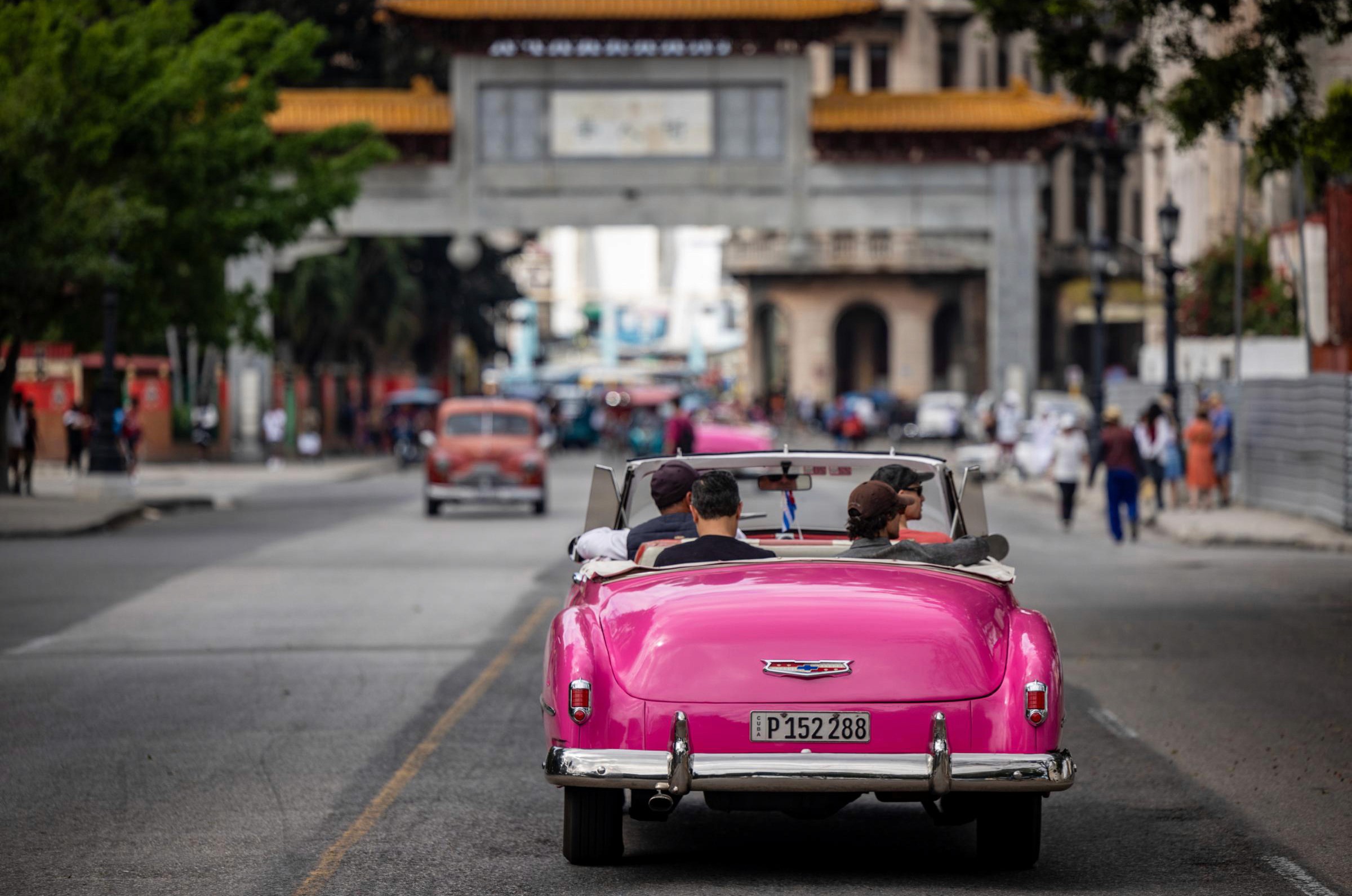 Pretty in Pink - Half of our crew ended up in the “Barbie Chevy,” seen here headed towards the gates of El Barrio Chino.