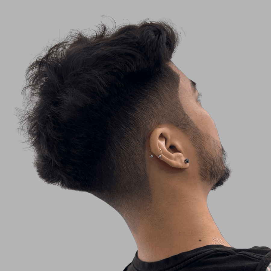 person holding white and gold hair comb