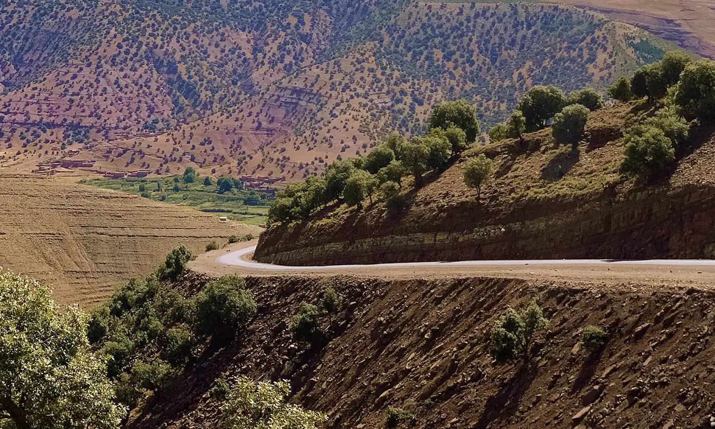 A distant narrow mountain road.