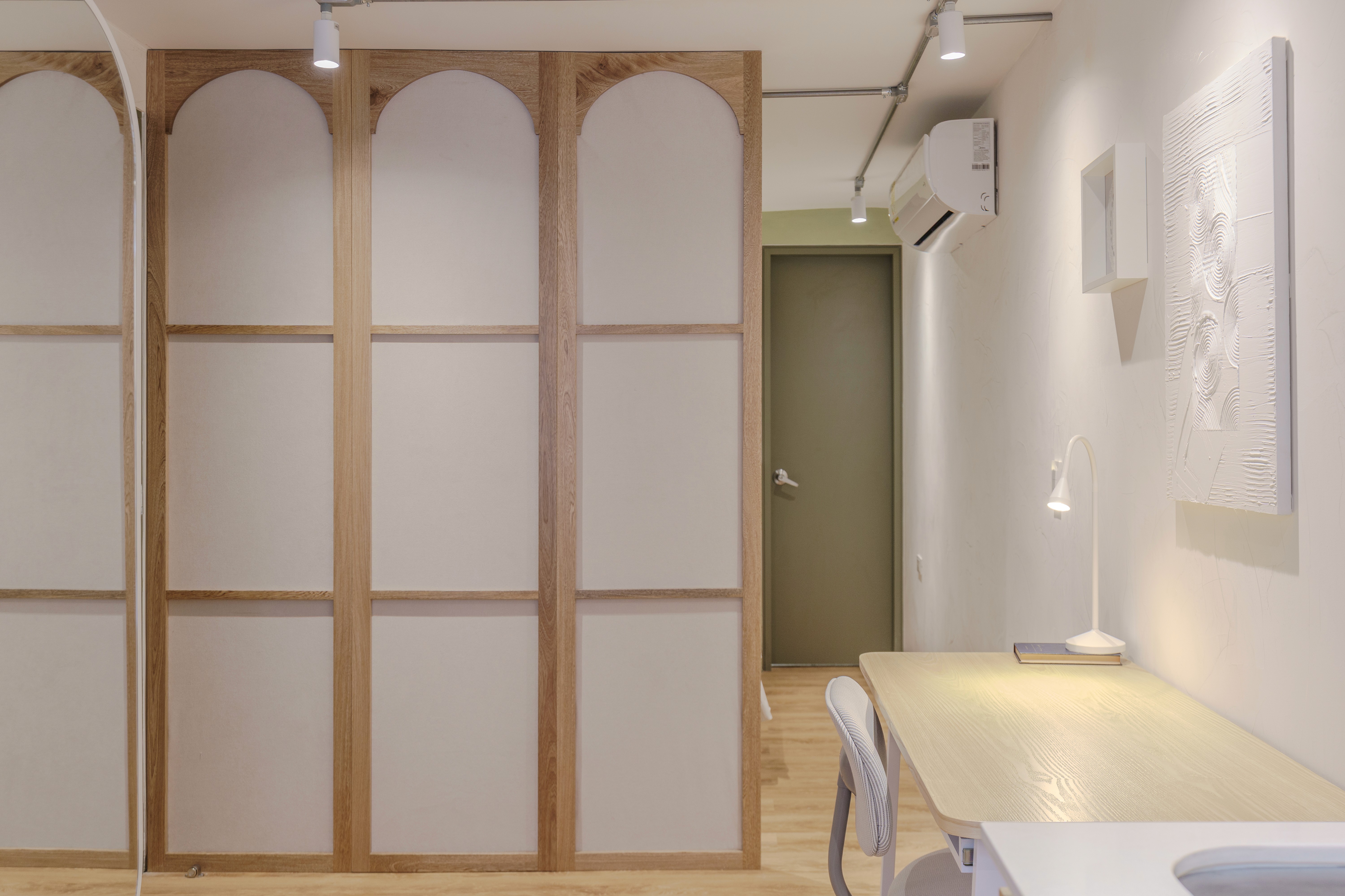 Double-height interior with flowing sculptural forms and warm raking light