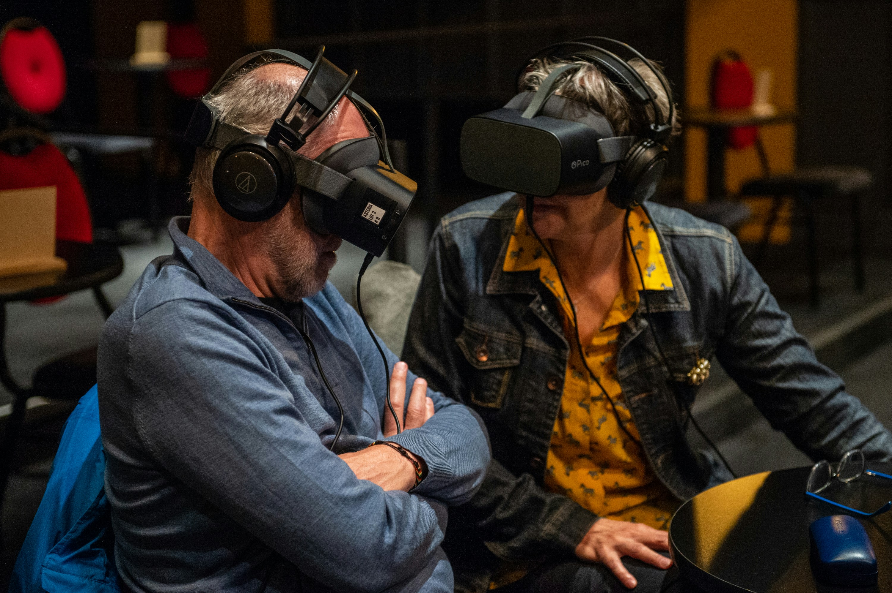 man in blue denim jacket wearing black headphones