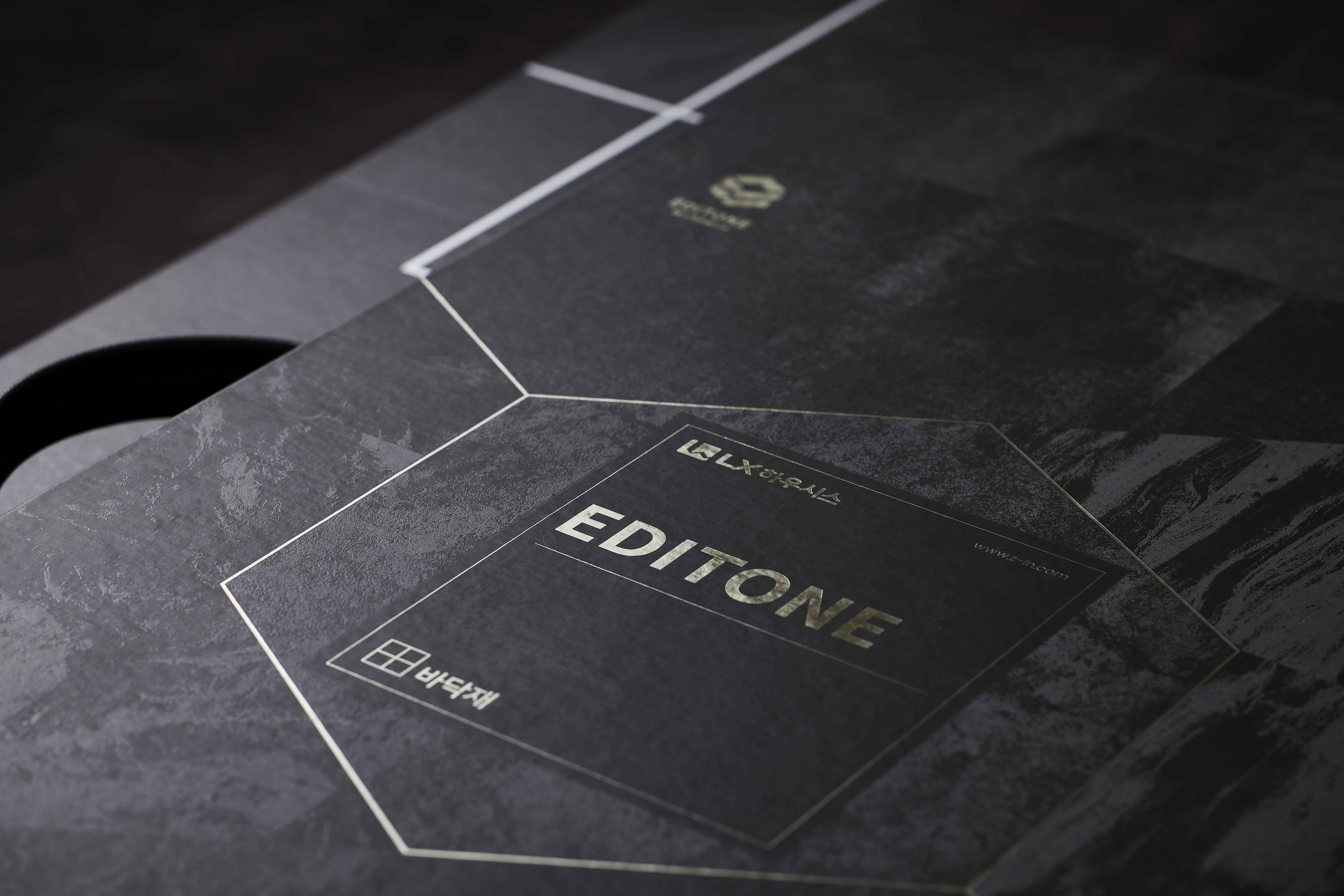 Image of a Laptop on top of an eletronic device